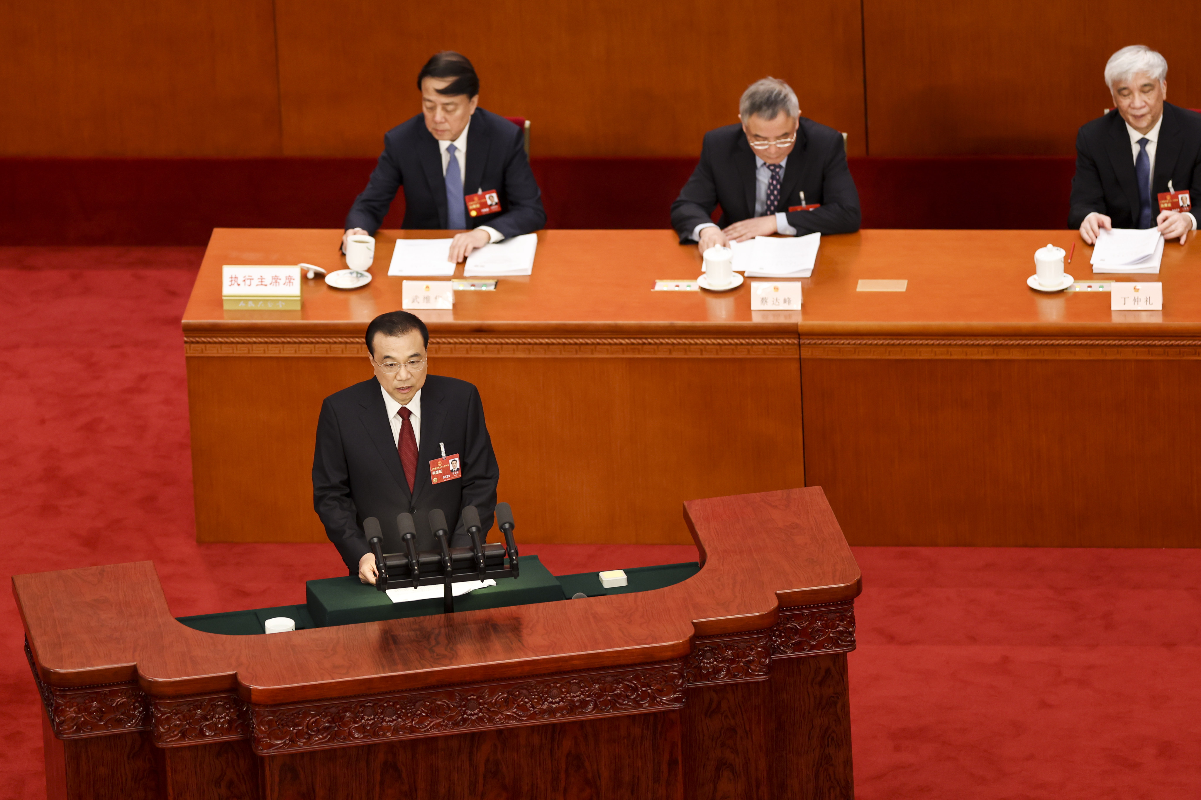 Chinese Premier Li Keqiang (bottom) delivers the annual government work report at the Great Hall of People on Sunday. Photo: Getty Images