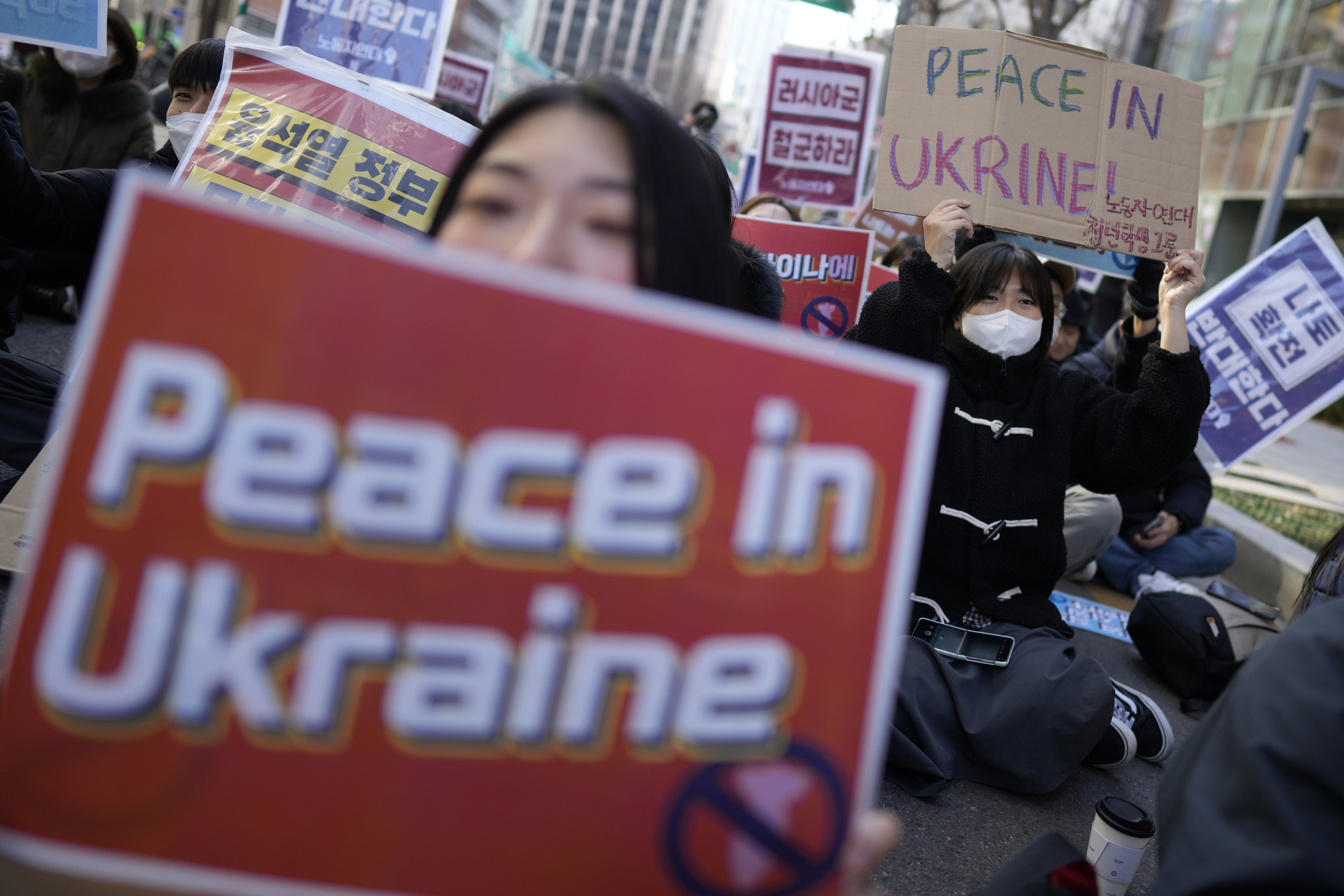 Protesters shout slogans during a rally to mark the one-year anniversary of Russia’s invasion of Ukraine, in downtown Seoul, South Korea, on February 25. Photo: AP