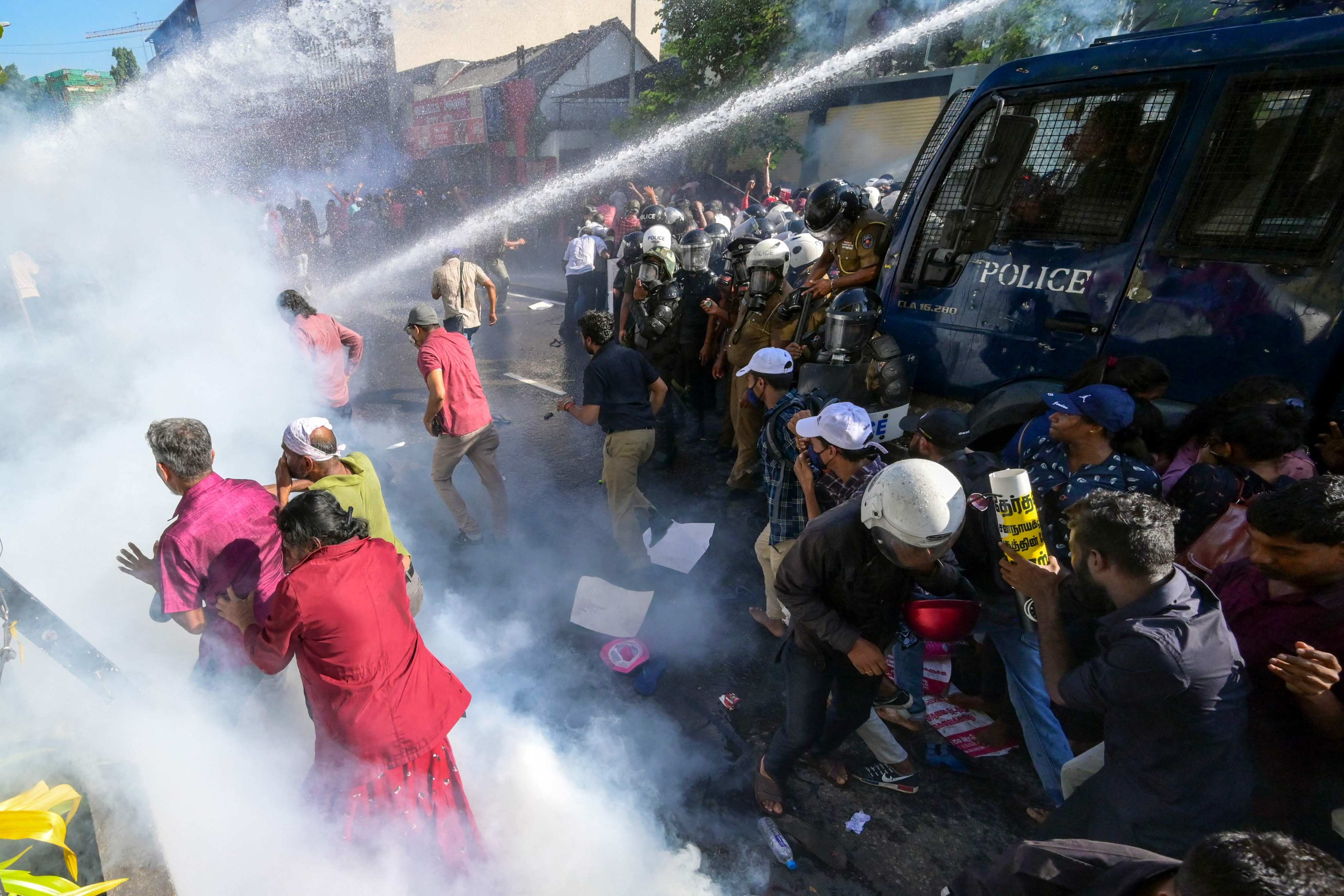 Police use water cannons and tear gas to disperse activists of the opposition National People’s Power (NPP) party during a protest held to urge the government to hold local council election as scheduled. Photo: AFP