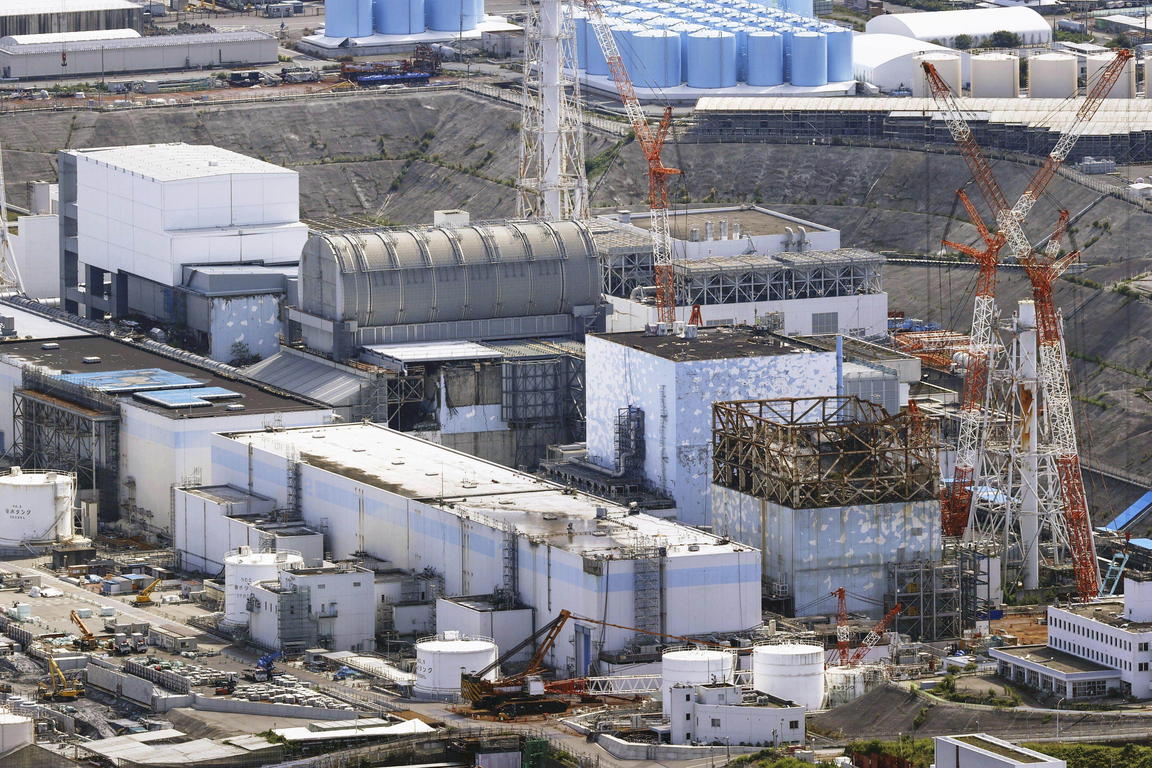 The reactor buildings of the Fukushima Daiichi nuclear power plant in Fukushima Prefecture in August 2022. Photo: Kyodo News via AP