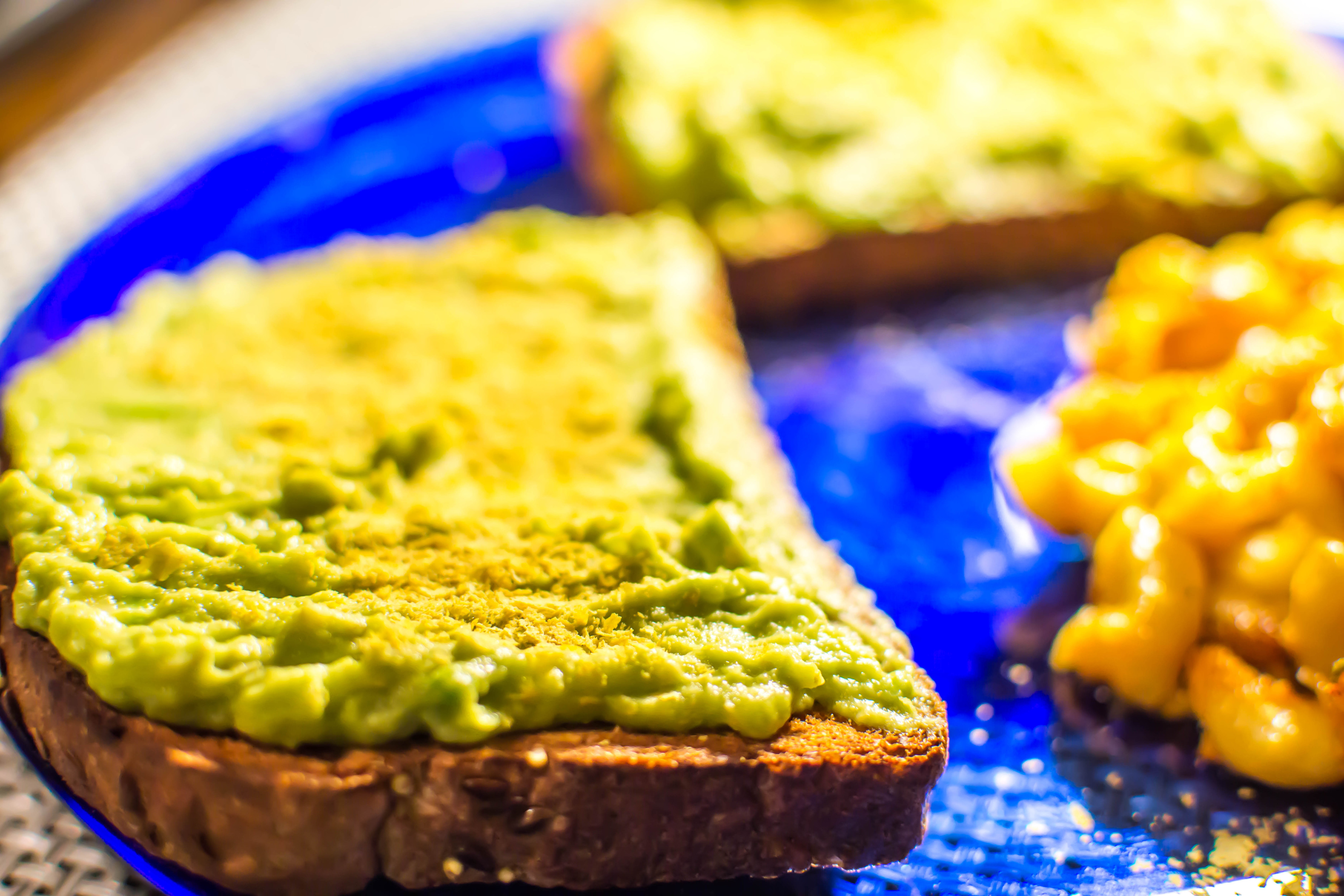 Nutritional yeast, or “nooch”, sprinkled on avocado toast adds a nutty, cheesy flavour. Photo: Shutterstock