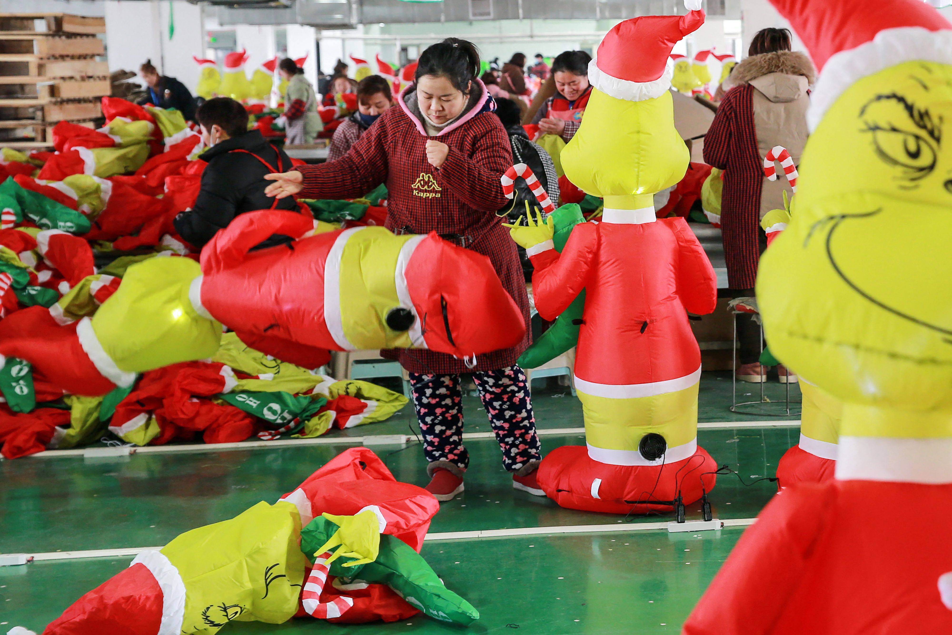 Women work at a factory producing inflatable Grinch toys for export at a factory in Huaibei, in China’s eastern Anhui province, on February 15. The official manufacturing sector’s PMI hit 52.6 in February. Photo: AFP