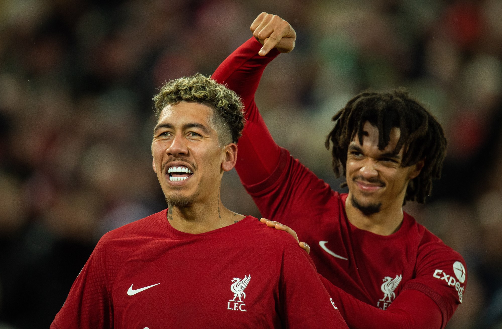 Liverpool’s Roberto Firmino is congratulated by Trent Alexander-Arnold after scoring their seventh goal. Photo: EPA-EFE