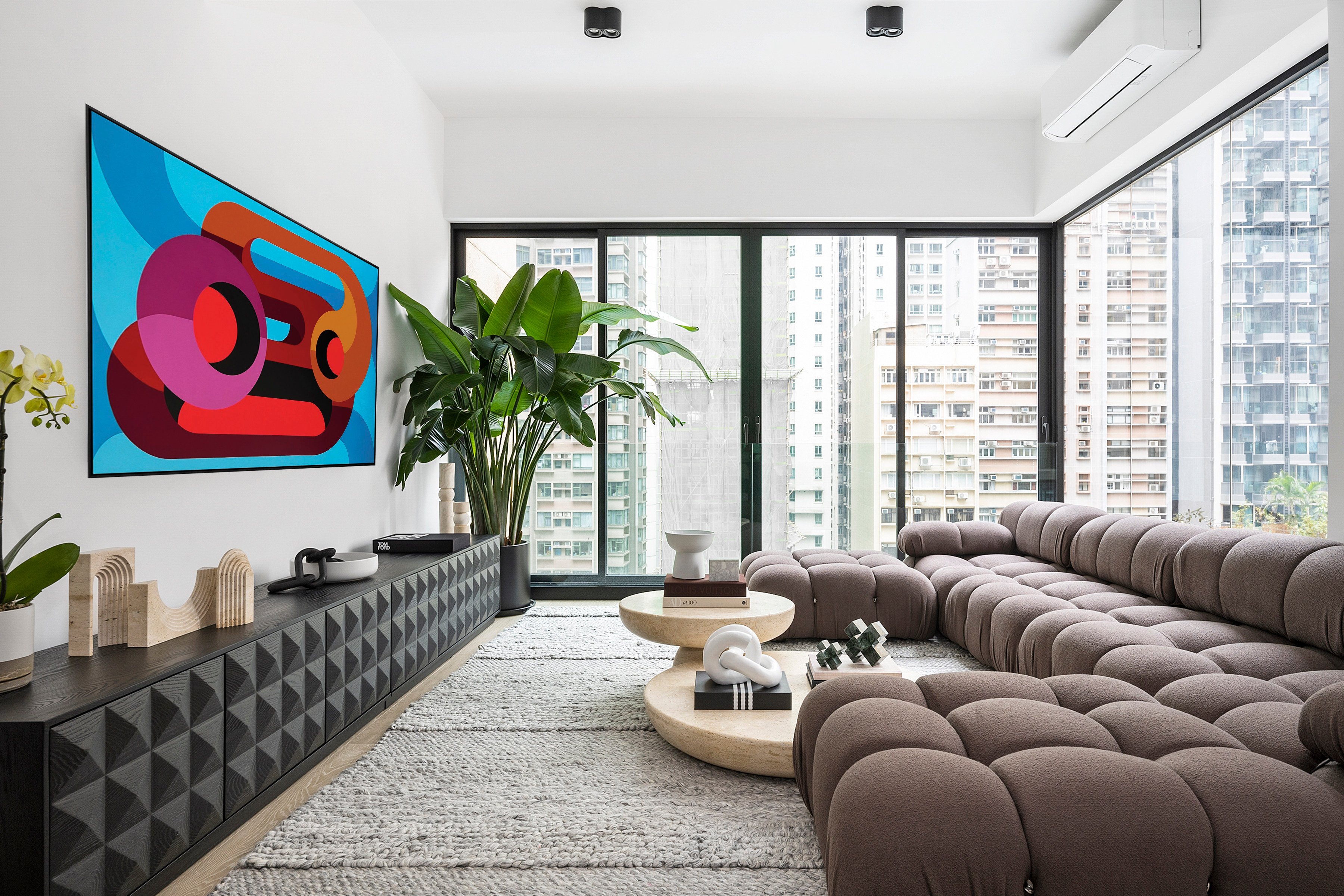 The living room in Eugene Wong’s Hong Kong flat. His home was renovated by his friend, a design enthusiast who fused modern and traditional elements to create a sleek, contemporary home. Photo: Desmond Chan