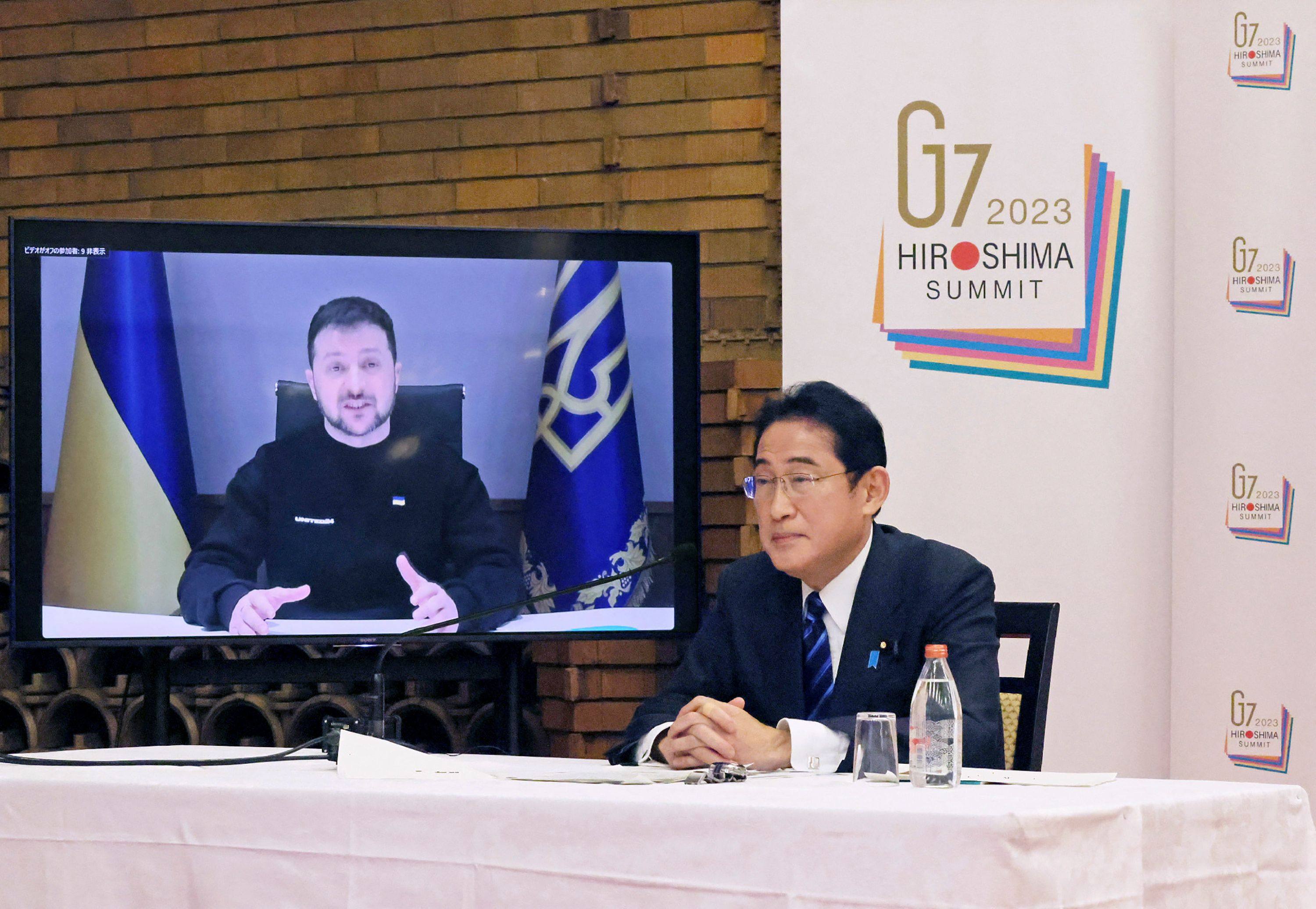 Japanese Prime Minister Fumio Kishida (right) listens as Ukrainian President Volodymyr Zelensky speaks during an online meeting with Group of 7 leaders at the prime minister’s official residence in Tokyo on February 24. Kishida faces a difficult task in pursuing his goal of increasing Japan’s diplomatic and military clout without damaging important relations with China and Russia. Photo: AFP