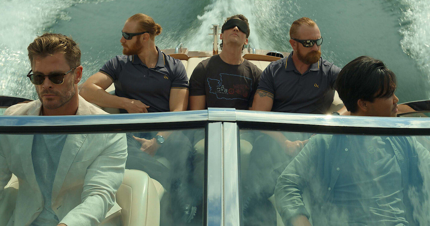 Chris Hemsworth (left) as state-of-the-art prison overseer Steve Abnesti, in a still from Spiderhead. Hemsworth and other actors have recently played “dangerous” tech bros, and Elon Musk isn’t happy. Photo: Netflix