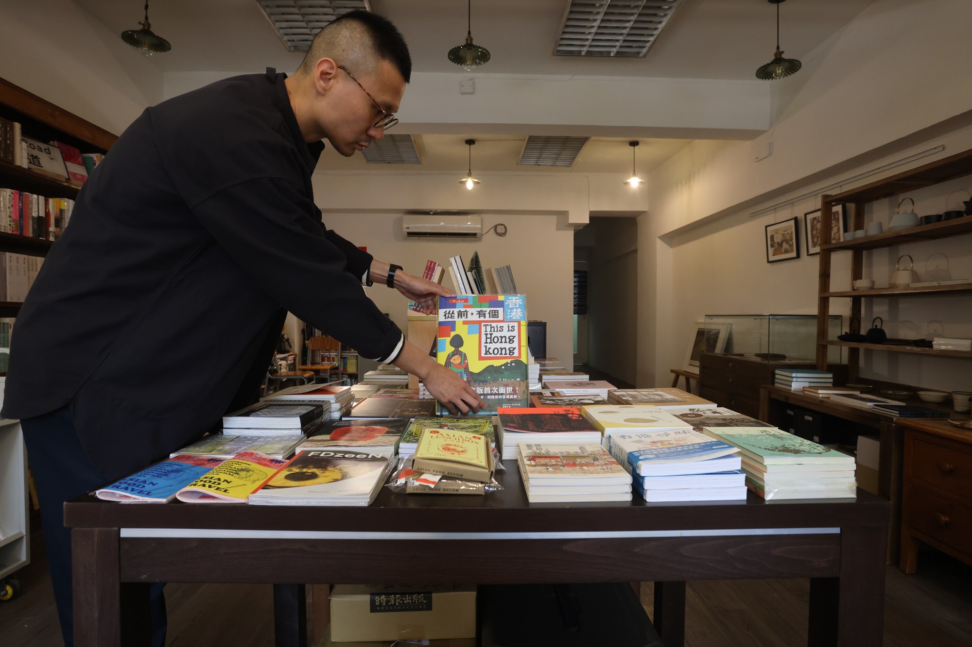 Lui at his store in Causeway Bay, where the books look beyond the latest food fads. Some are specific and deeply researched. Photo: Jonathan Wong