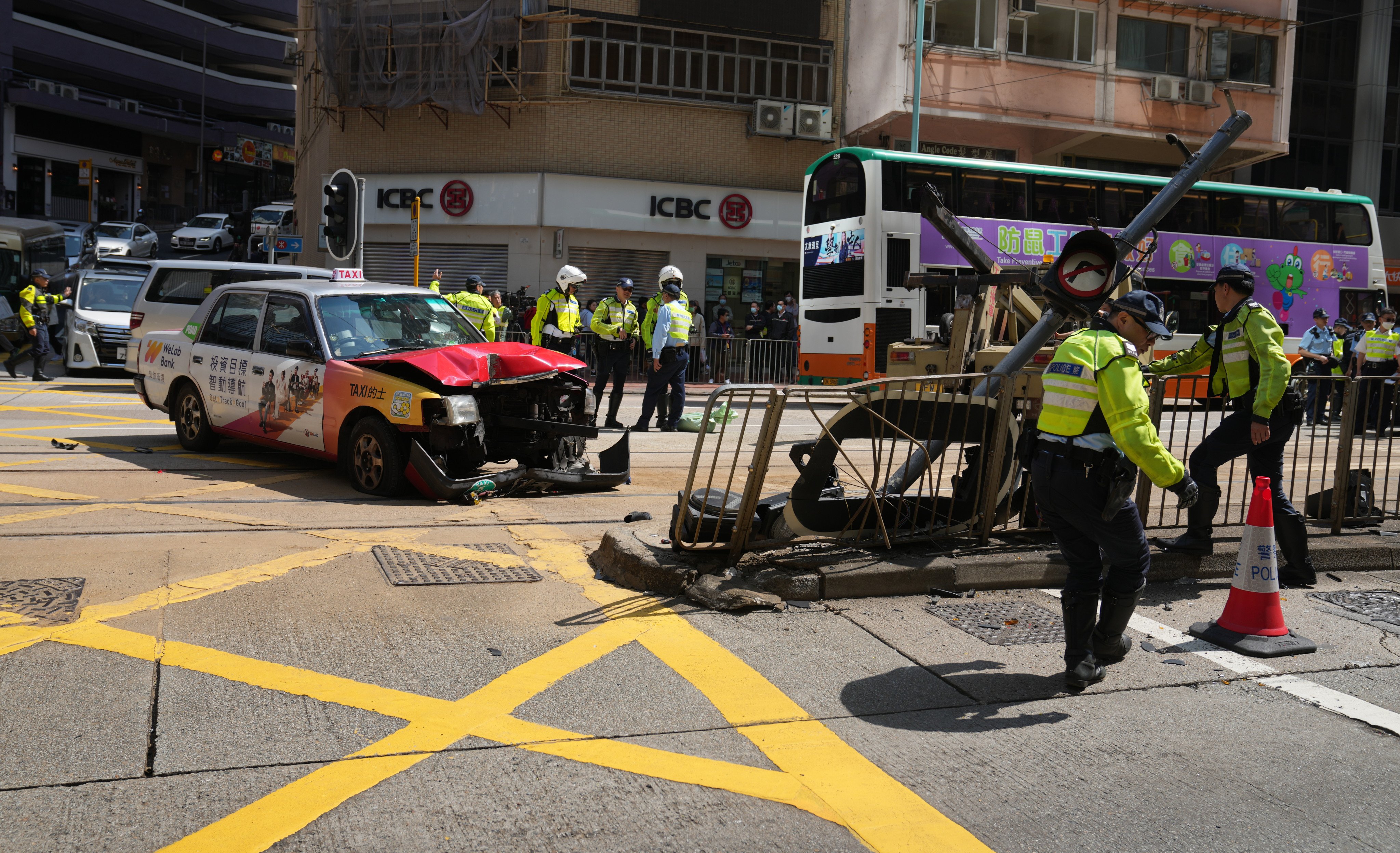 Police investigate a traffic accident on King’s Road in Fortress Hill on March 5. At least three people were injured after a taxi ploughed into pedestrians at a crossing. Photo: Sam Tsang