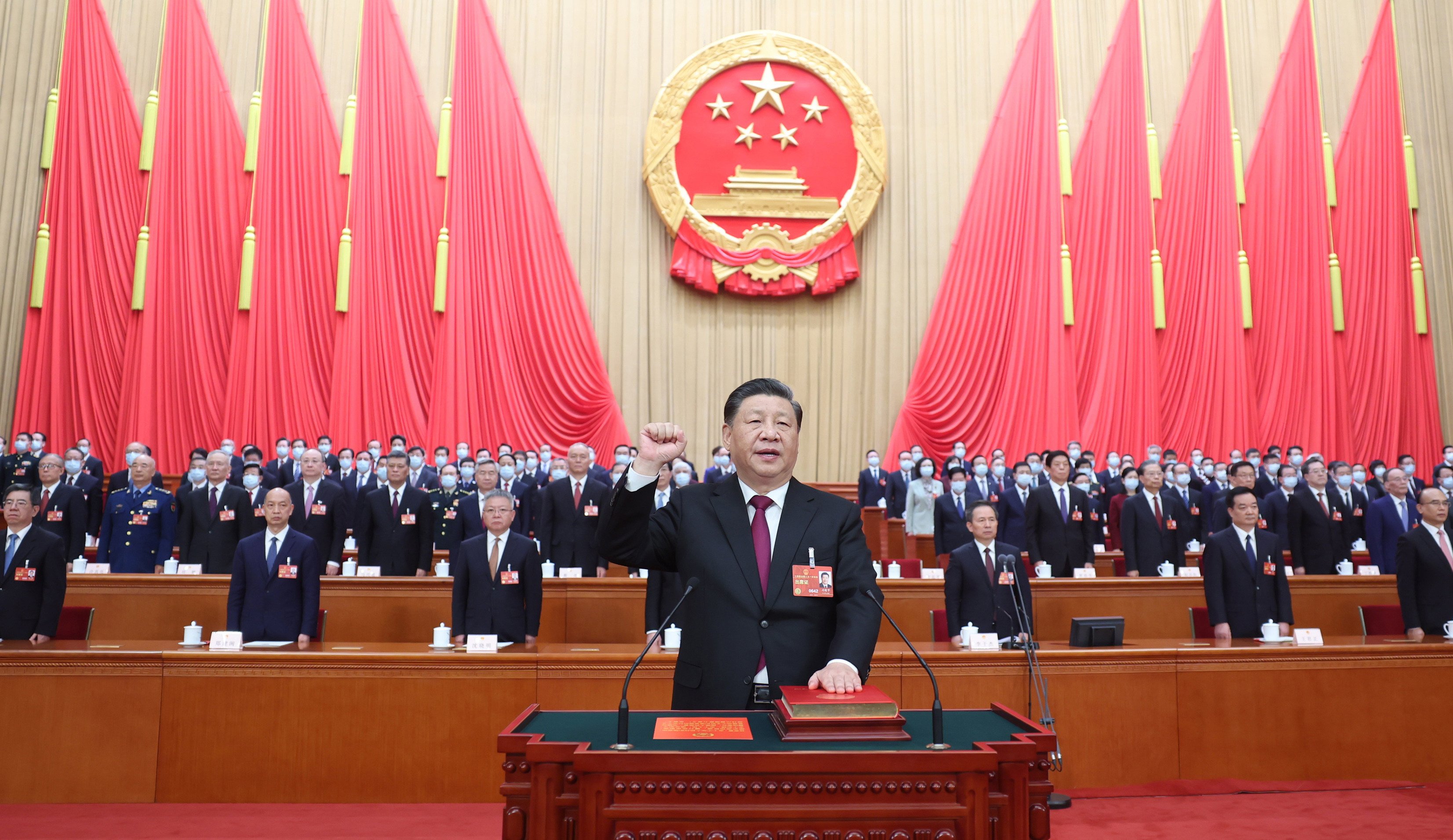 President Xi Jinping makes a public pledge of allegiance to the constitution at the Great Hall of the People in Beijing on March 10. Xi was unanimously re-elected president and chairman of the Central Military Commission. Photo: Xinhua