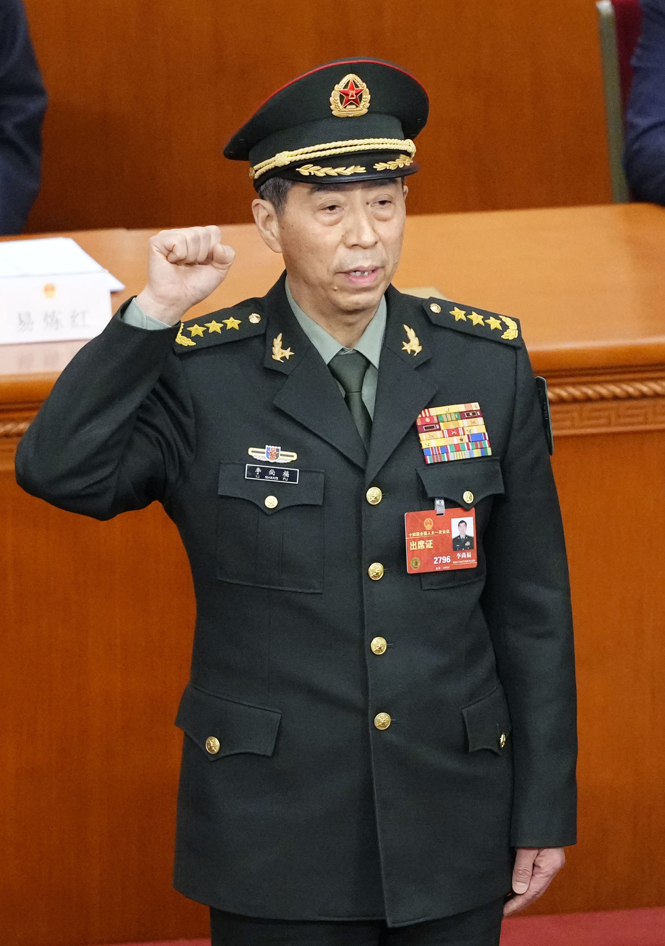 General Li Shangfu takes an oath after being elected as state councillor during the National People’s Congress in Beijing. He was also appointed as defence minister. Photo: Kyodo
