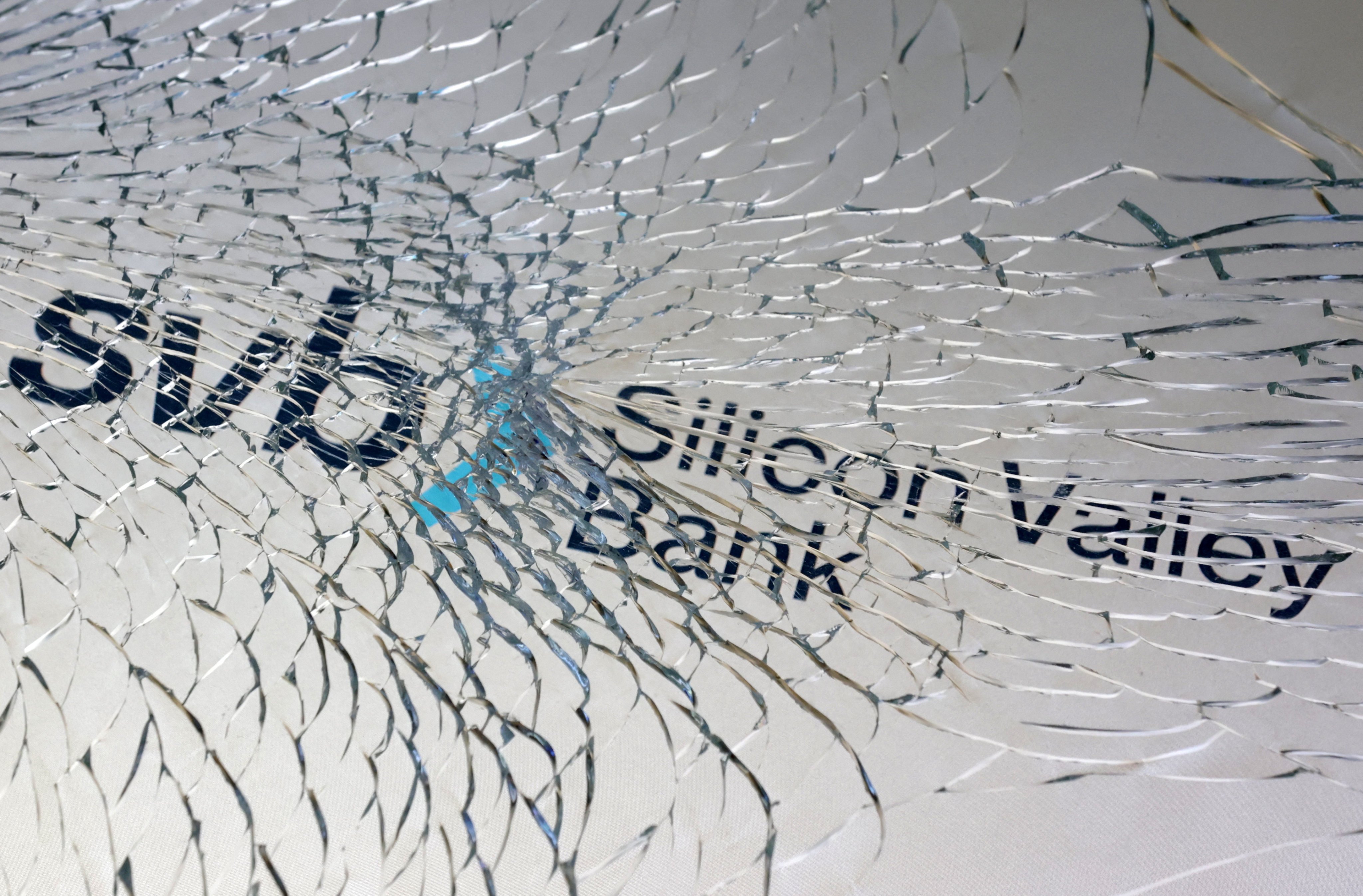 FILE PHOTO: SVB (Silicon Valley Bank) logo is seen through broken glass in this illustration taken March 10, 2023. REUTERS/Dado Ruvic/Illustration/File Photo