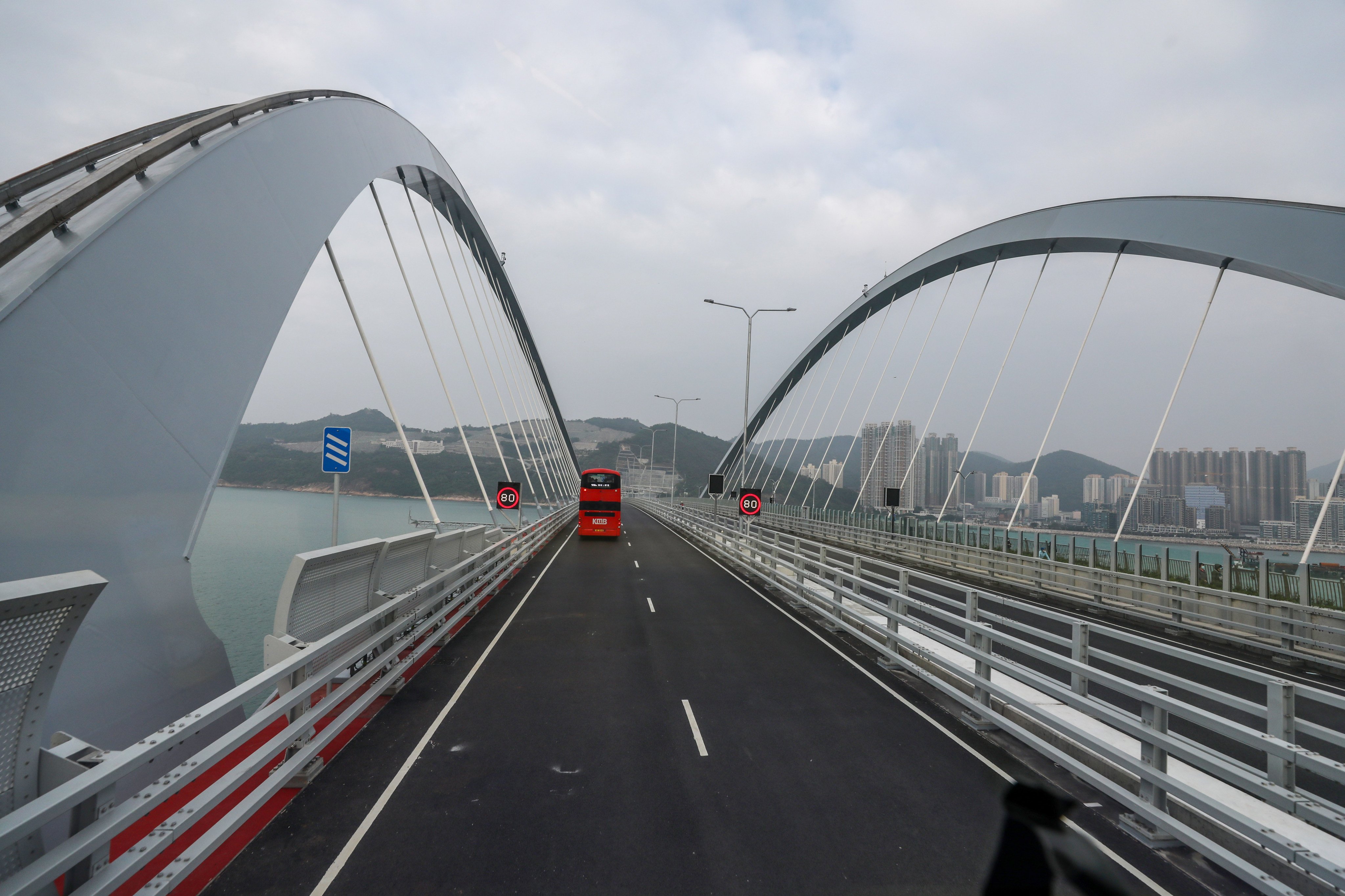 A bus crosses a new bridge in Tseung Kwan O on December 12. Capital expenditure costs Hong Kong HK$100 billion per annum. Photo: Xiaomei Chen