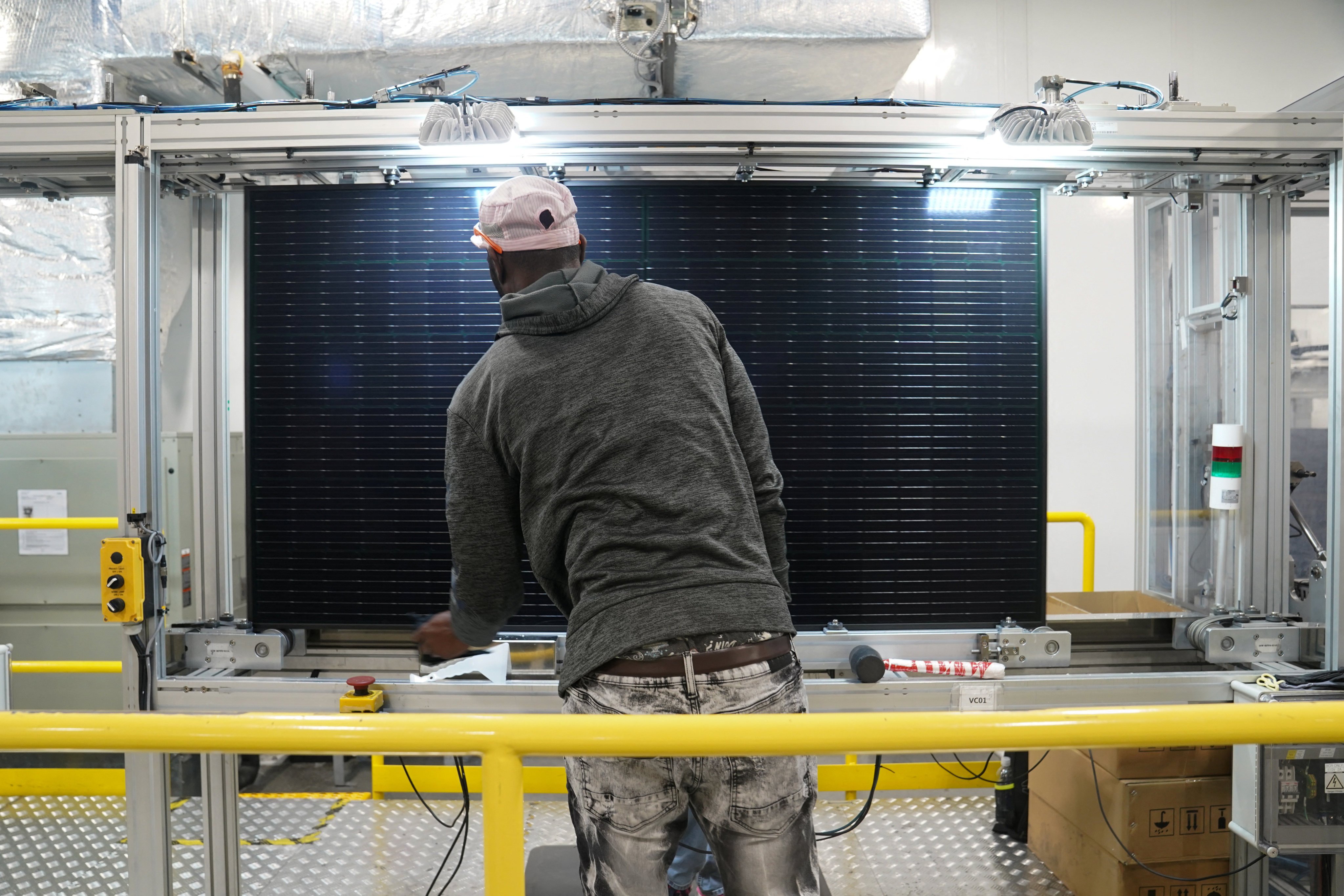 An employee works on solar panels at the QCells solar energy manufacturing plant in Dalton, Georgia, on March 2. The US industrial base has suffered from decades of decline and underinvestment, putting the country’s future economic stability at risk. Photo: Reuters