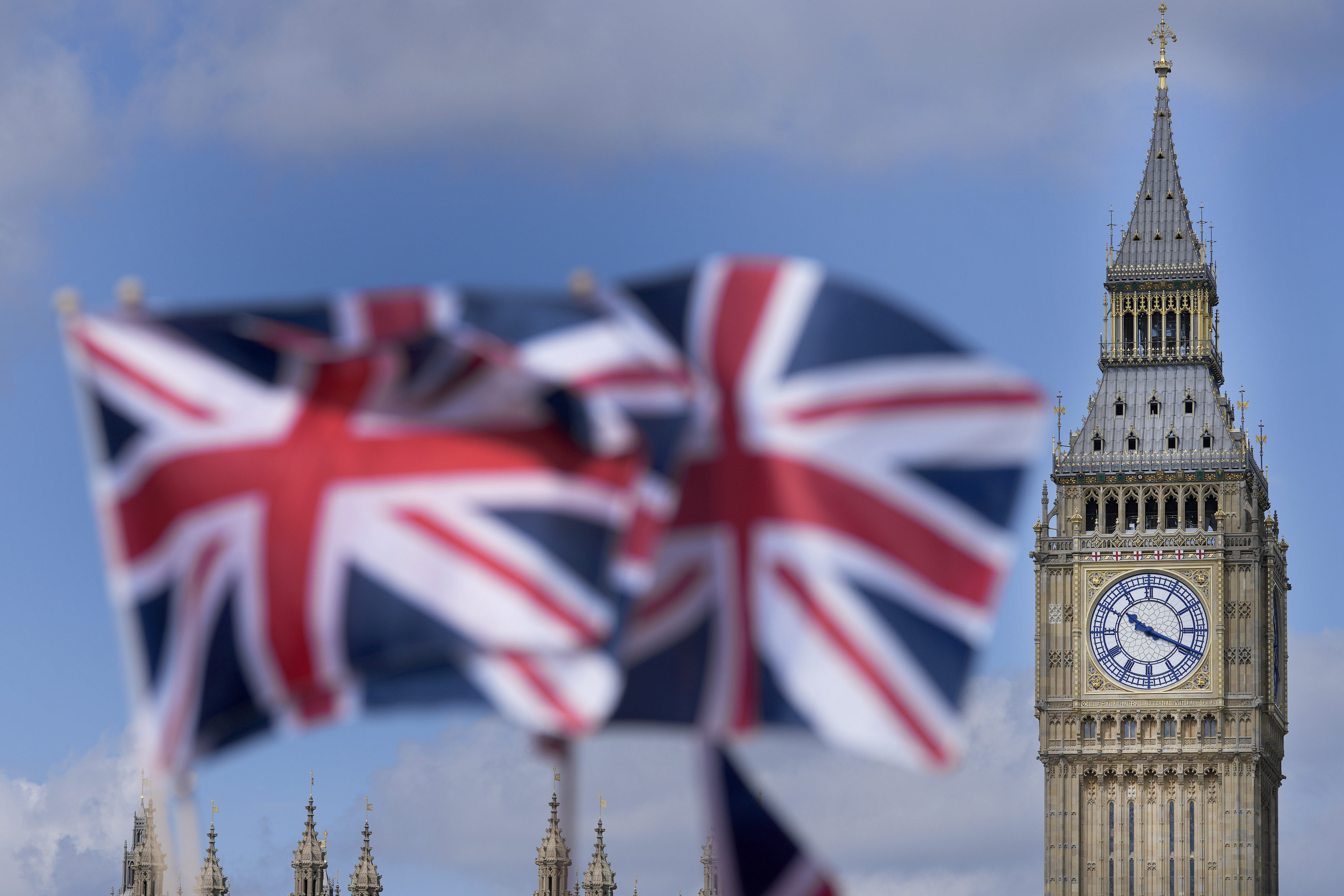 Union Jack flags are seen in front of the Elizabeth Tower, known as Big Ben, beside the Houses of Parliament in London in June 2022. Photo: AP
