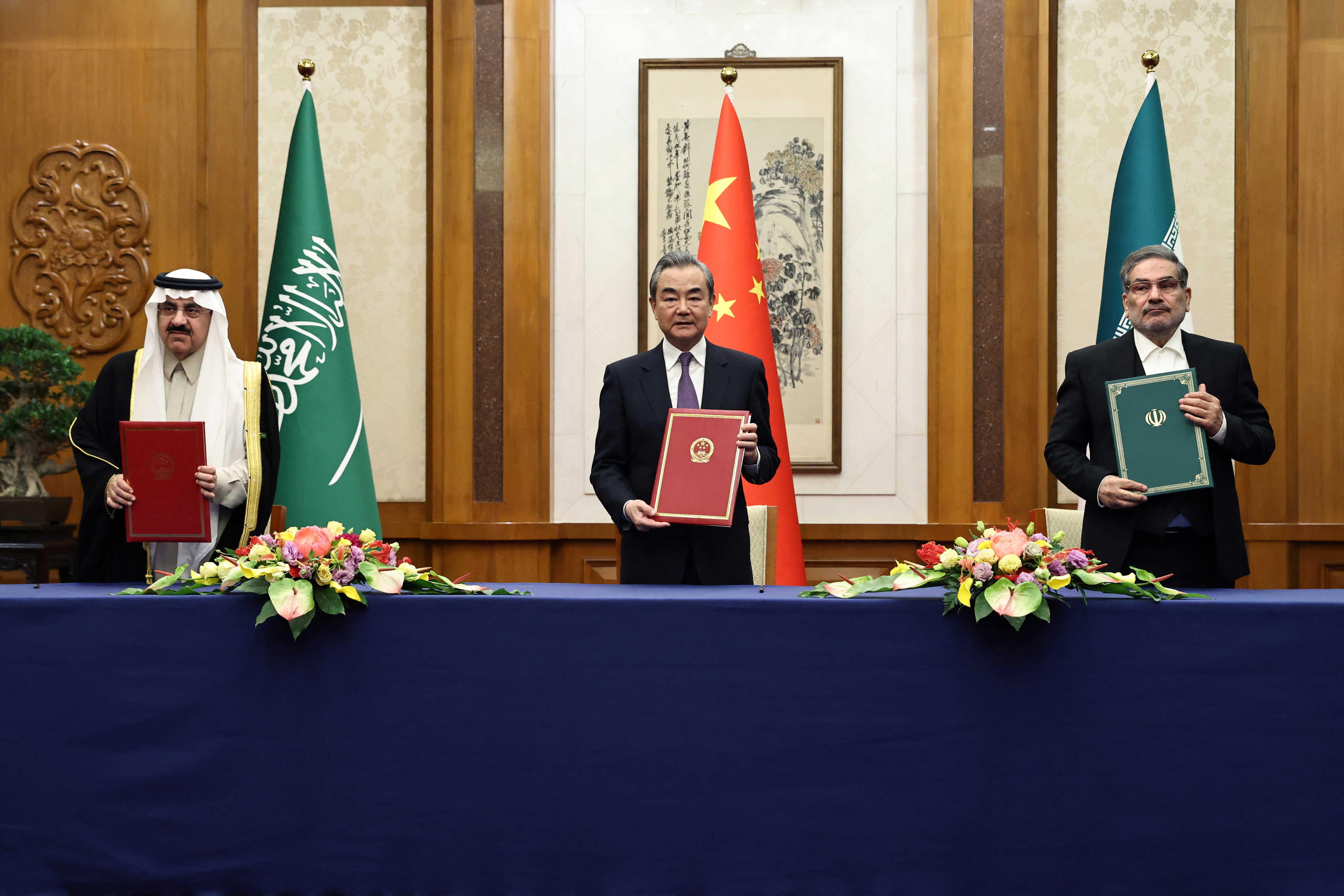 China’s top diplomat Wang Yi (centre) attends a meeting with Saudi Arabia’s national security adviser Musaad bin Mohammed Al-Aiban (left) and Ali Shamkhani, secretary of Iran’s Supreme National Security Council, in Beijing on March 10. Whether the China-brokered detente between Riyadh and Tehran holds will be keenly watched. Photo: China Daily via Reuters