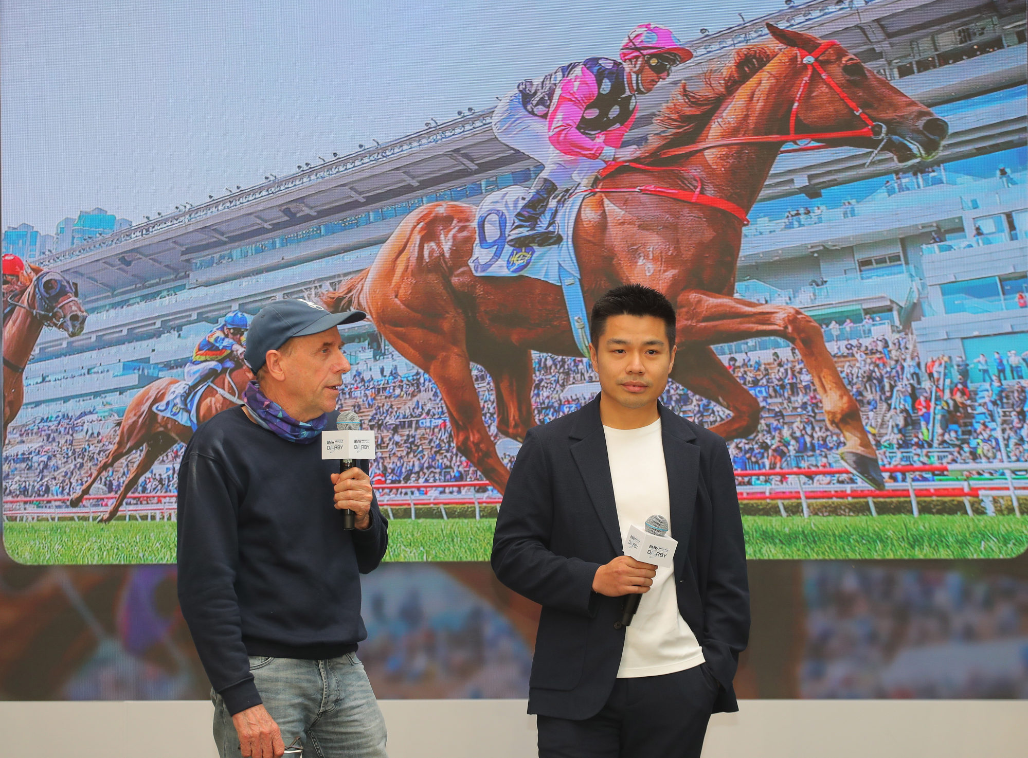 Trainer John Size (left) and owner Patrick Kwok (right) discuss the Hong Kong Derby chances of Beauty Eternal.