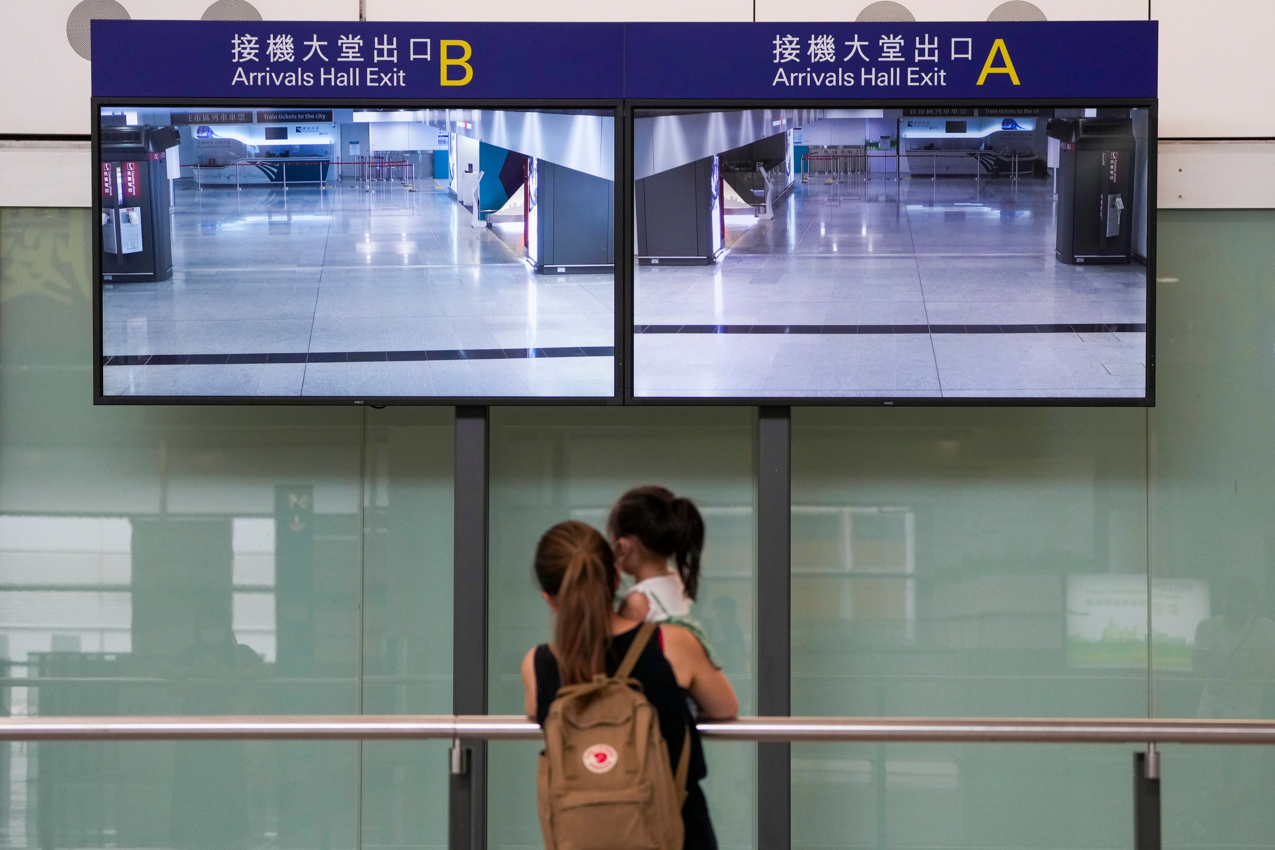 Passengers arrive at Hong Kong International Airport in Chek Lap Kok on 9 October 2022. This photograph won Sam Tsang the 2nd Runner-up award in the Best Photograph (News) award. Photo: Sam Tsang.