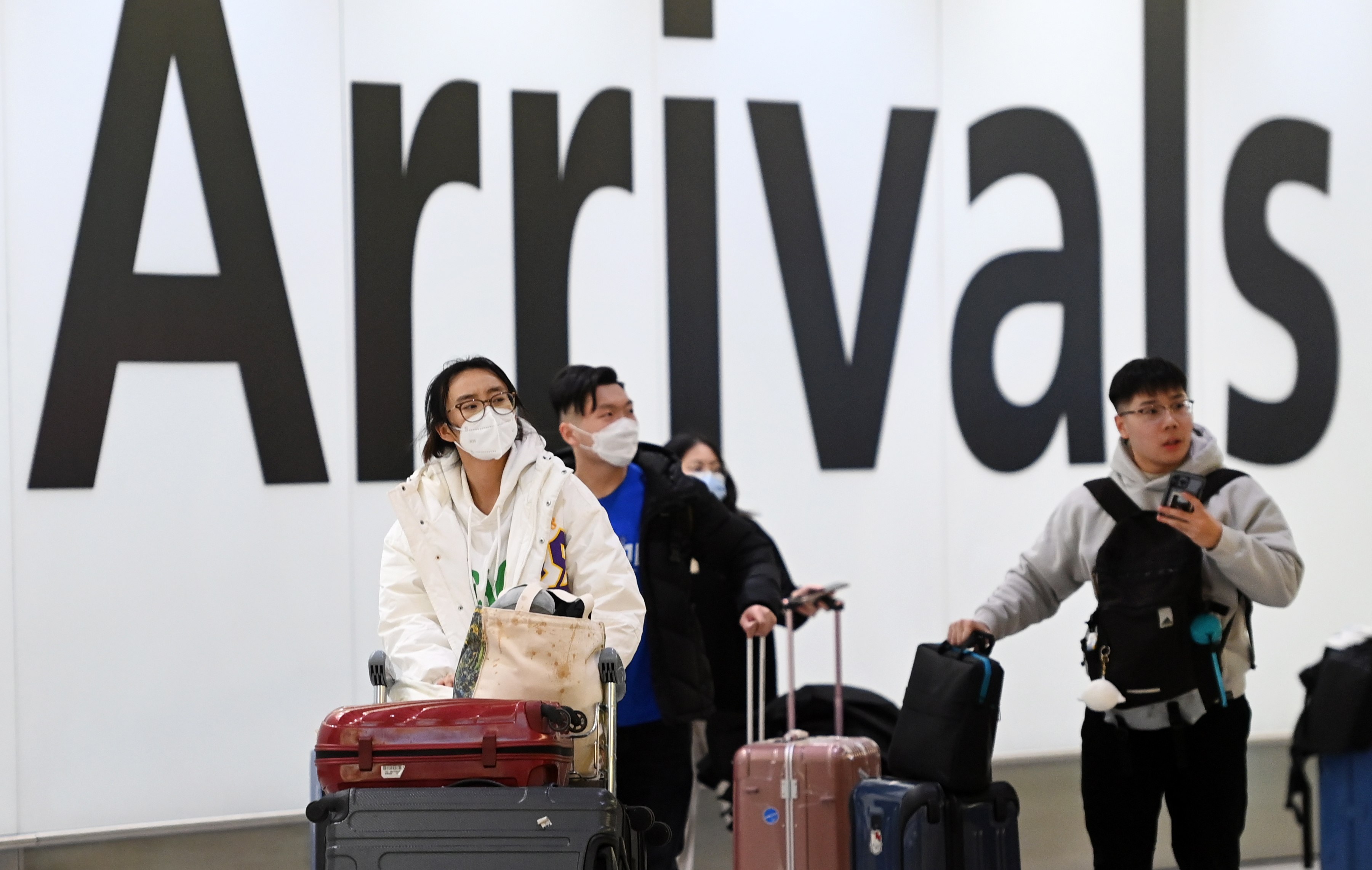 People traveling from China arrive at London’s Heathrow Airport in January. EPA-EFE