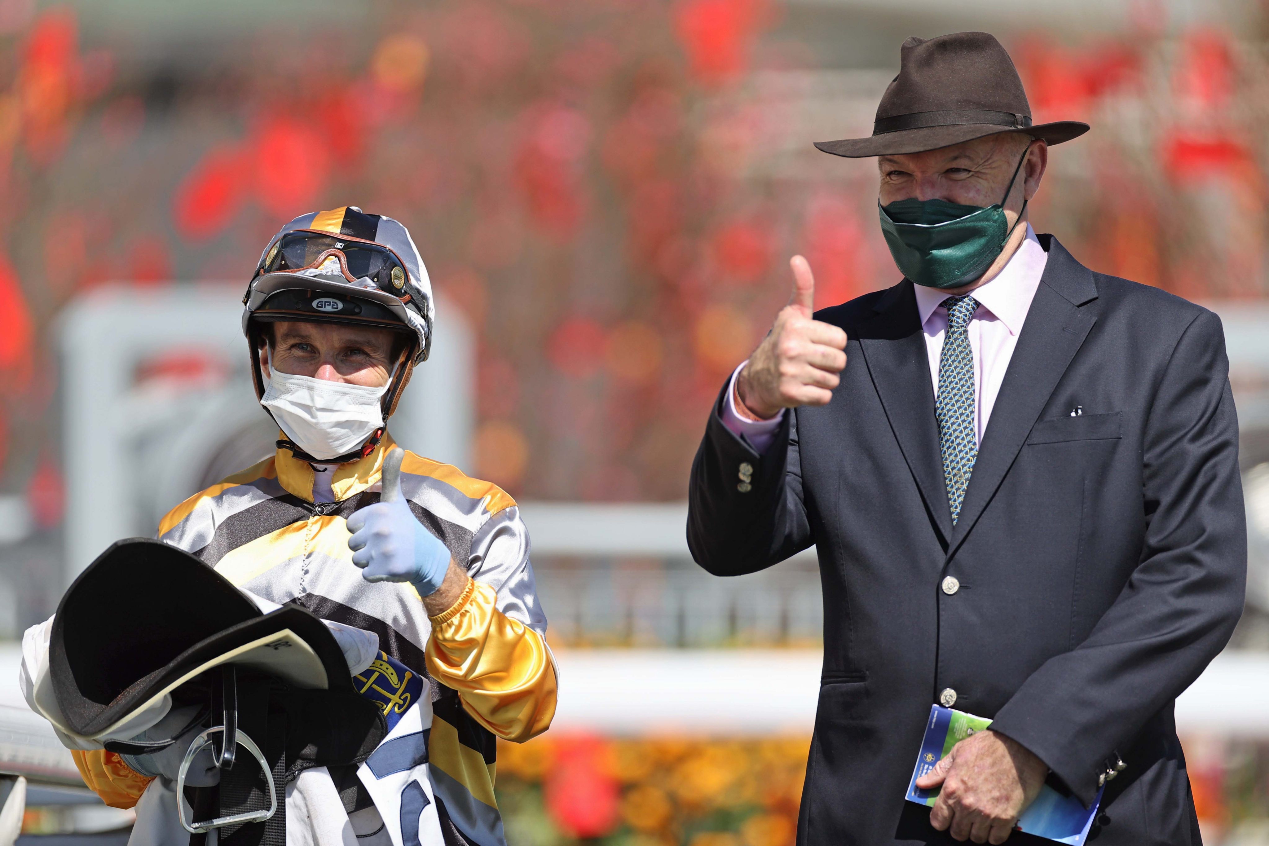 Luke Currie celebrates his first Hong Kong win in January 2022 with Miracle Victory’s trainer, David Hayes. Photo: HKJC