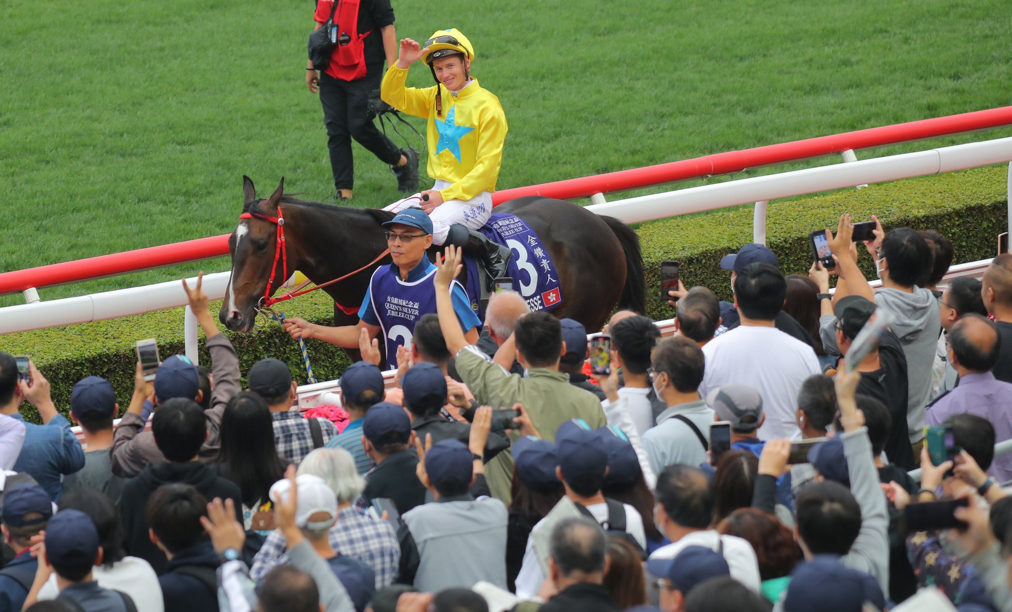 James McDonald salutes the Sha Tin crowd after winning aboard Lucky Sweynesse. James McDonald salutes the Sha Tin crowd after winning aboard Lucky Sweynesse.