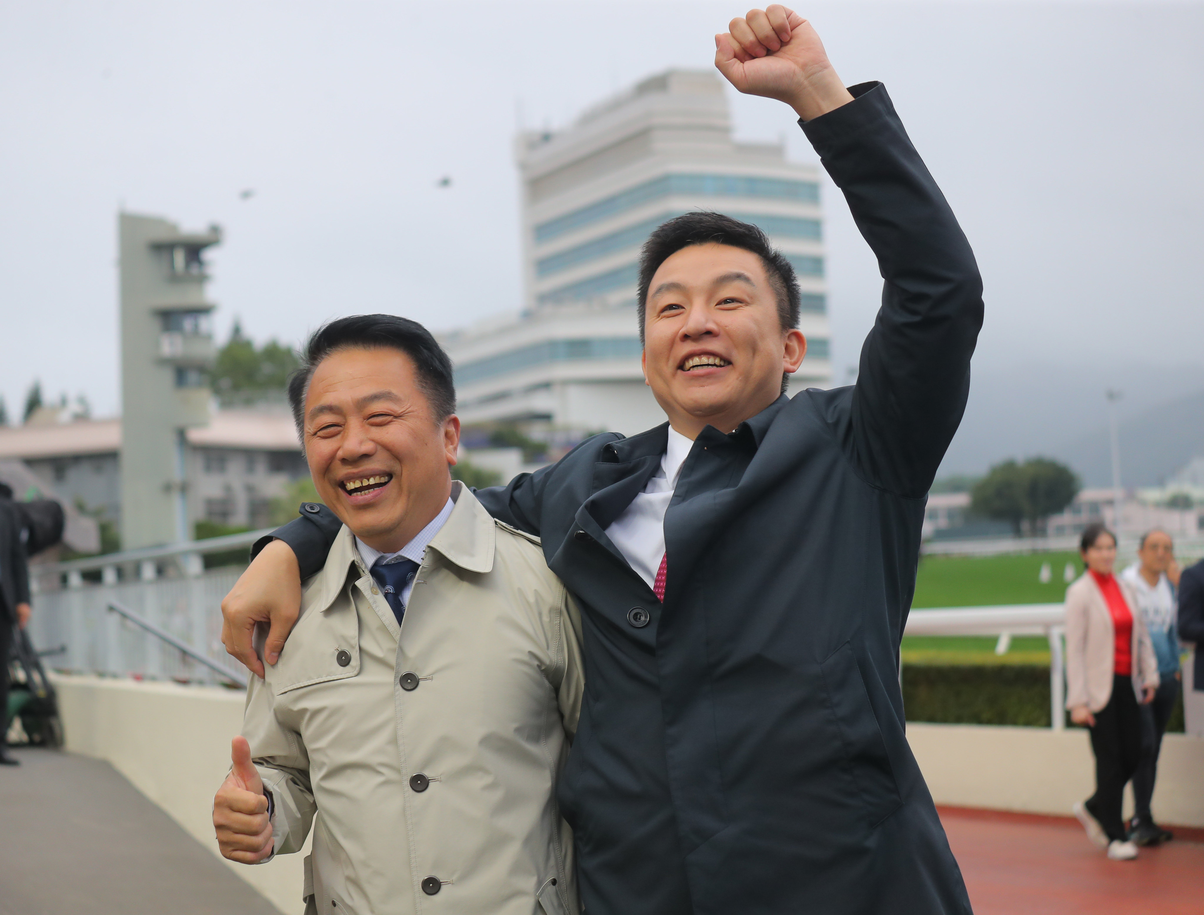 Trainer Ricky Yiu (left) celebrates Voyage Bubble’s BMW Hong Kong Derby win with his son Eric at Sha Tin on Sunday. Photo: Kenneth Chan