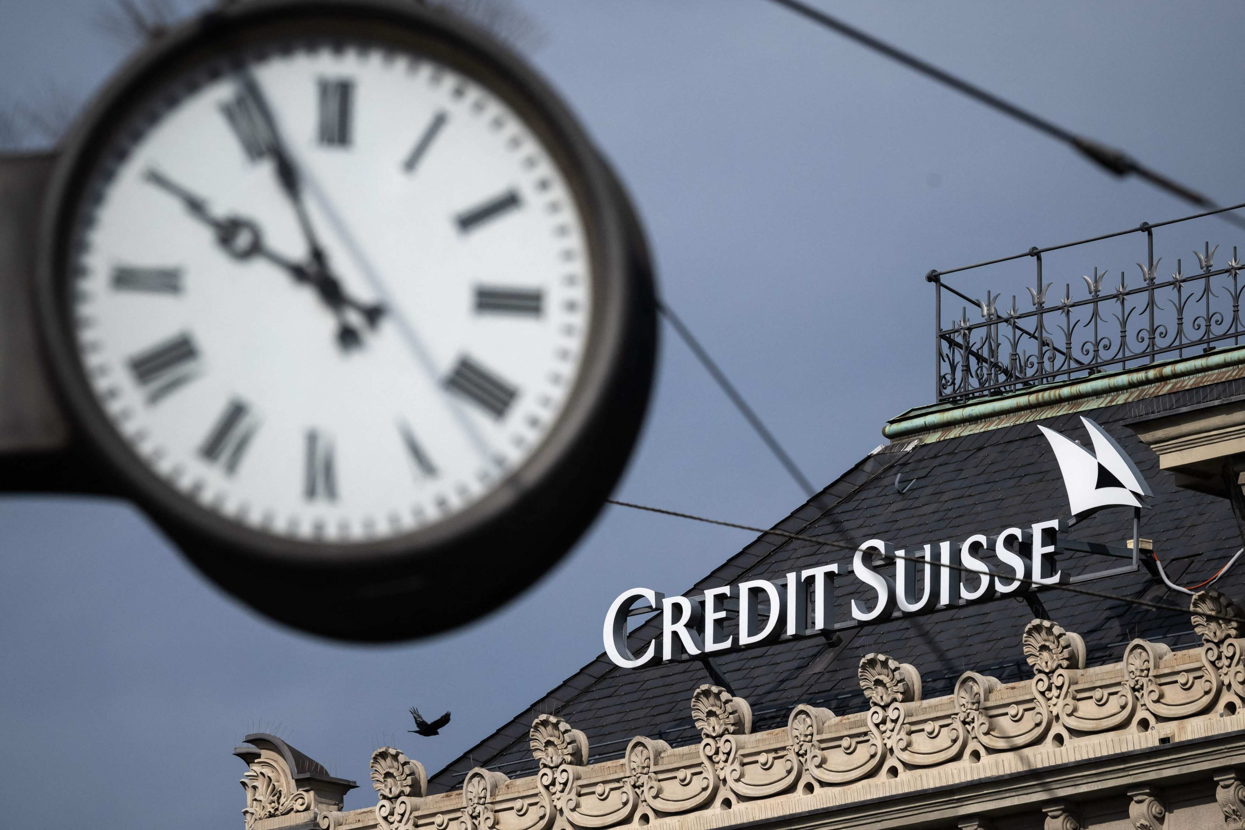 The Credit Suisse logo next to a clock at the bank’s headquarters in Zurich on Sunday. Photo: AFP
