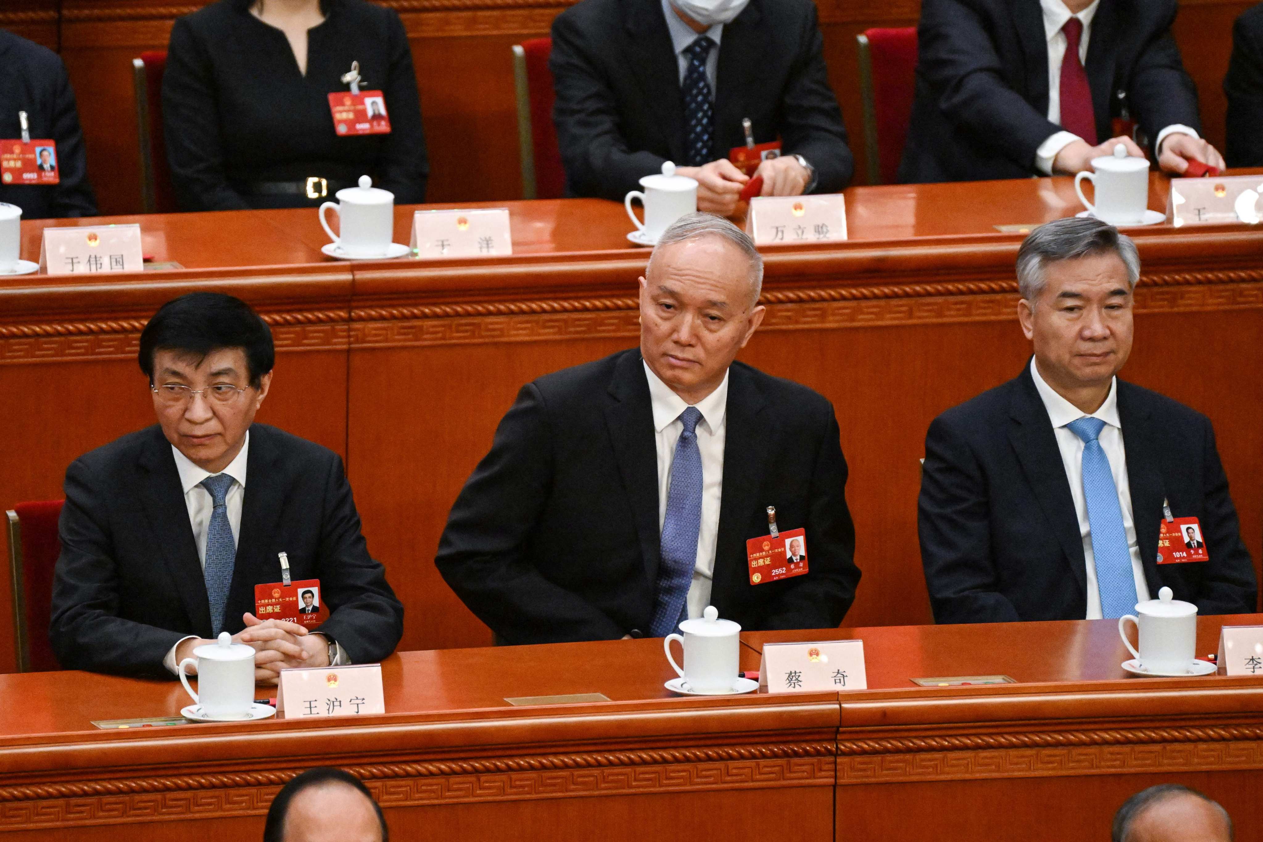 From left: Chinese People’s Political Consultative Conference (CPPCC) Chairman Wang Huning and Politburo Standing Committee members Cai Qi and Li Xi attend the fifth plenary session of the National People’s Congress (NPC). Photo: AFP