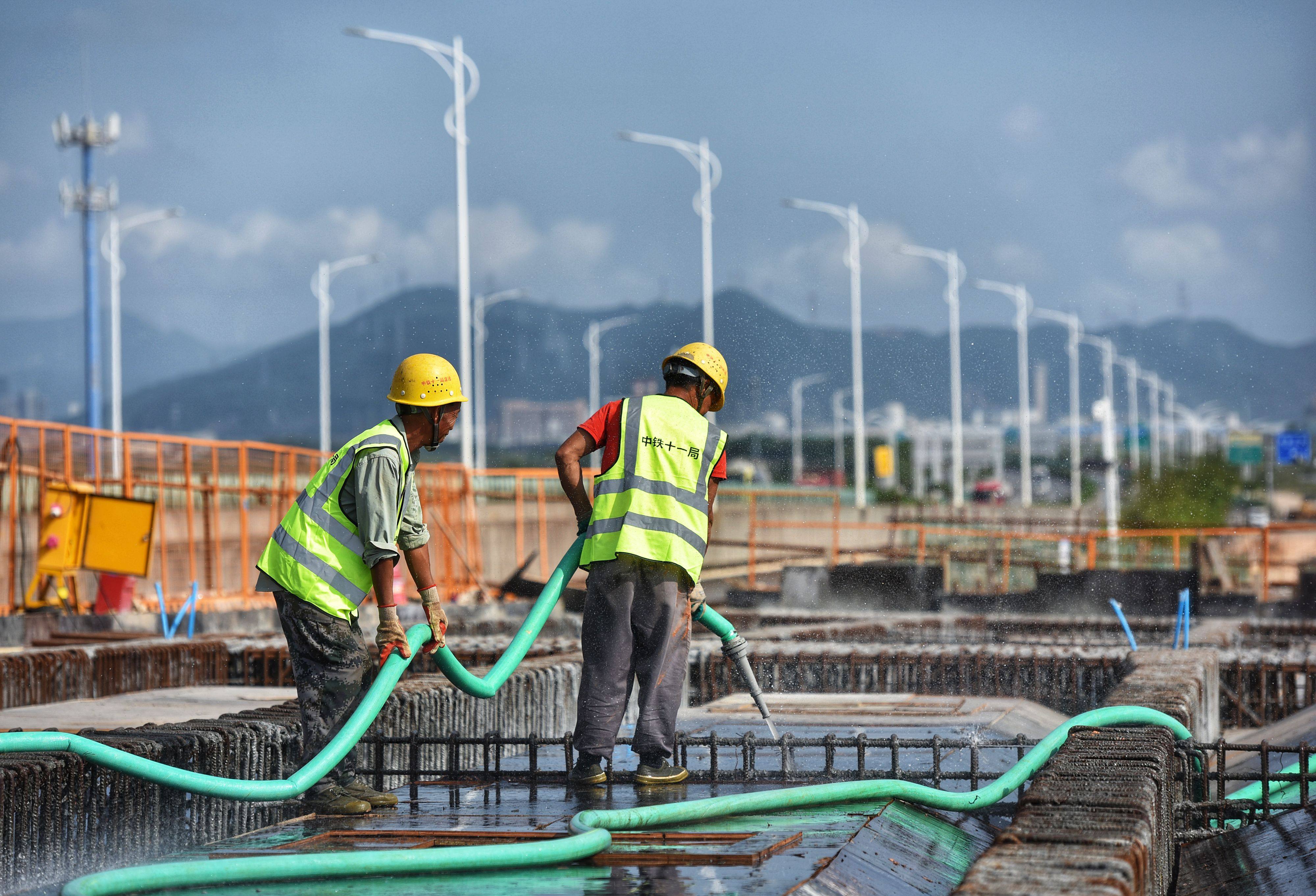 Workers at the construction site of Gaolan Harbour Interchange of Hezhou-Gaolan Port Highway project in south China’s Guangdong province on May 5. Chinese regulators have prioritised infrastructure assets in its fledgling Reit market. Photo: Xinhua