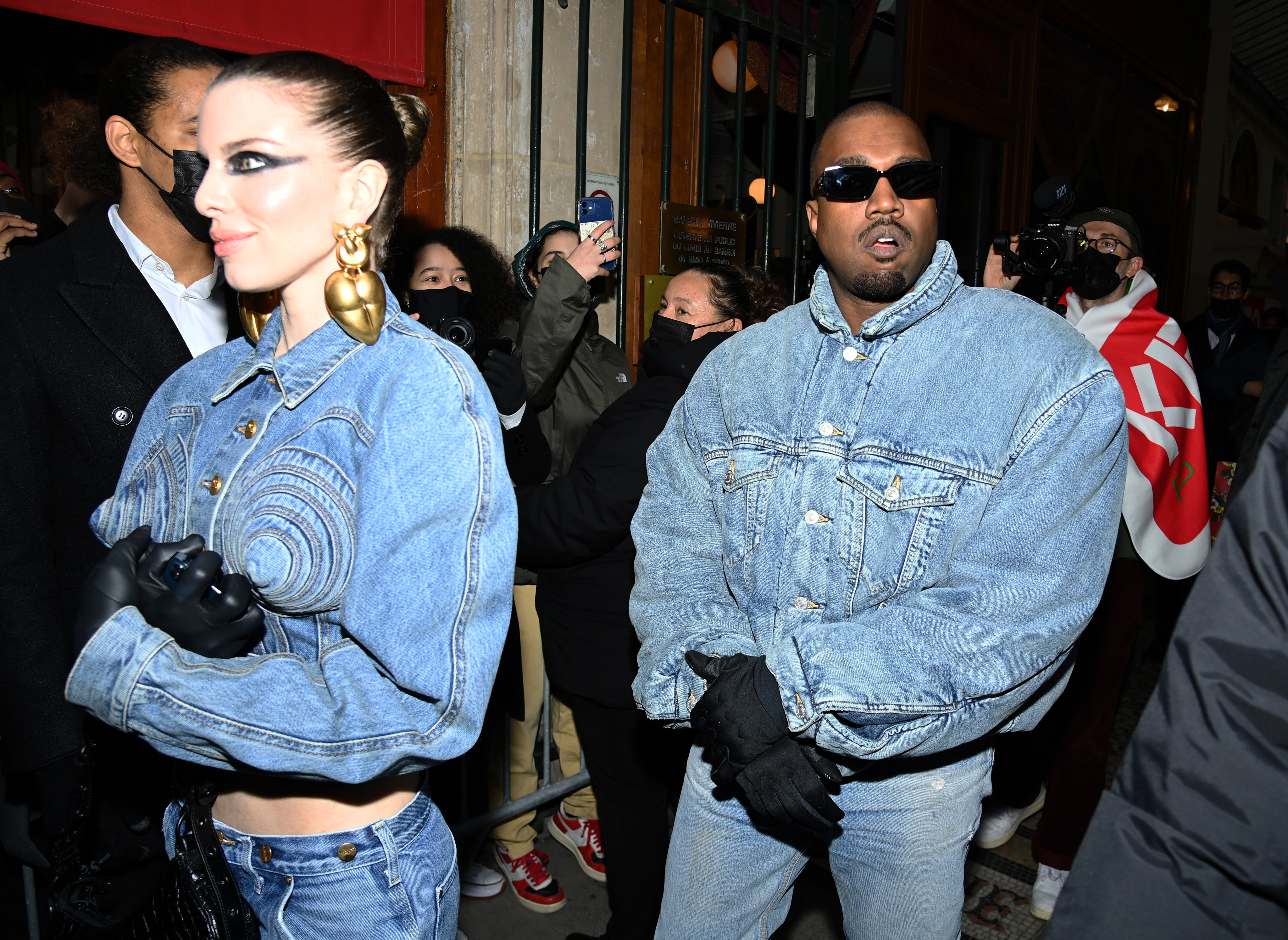 Ye (aka Kanye West) and Julia Fox at the Kenzo show as part of Paris Fashion Week in January 2022. Denim is back in the spotlight post-Covid, with designer and contemporary labels alike putting a dramatic spin on the all-American staple and stars embracing the fabric. Photo: Getty Images