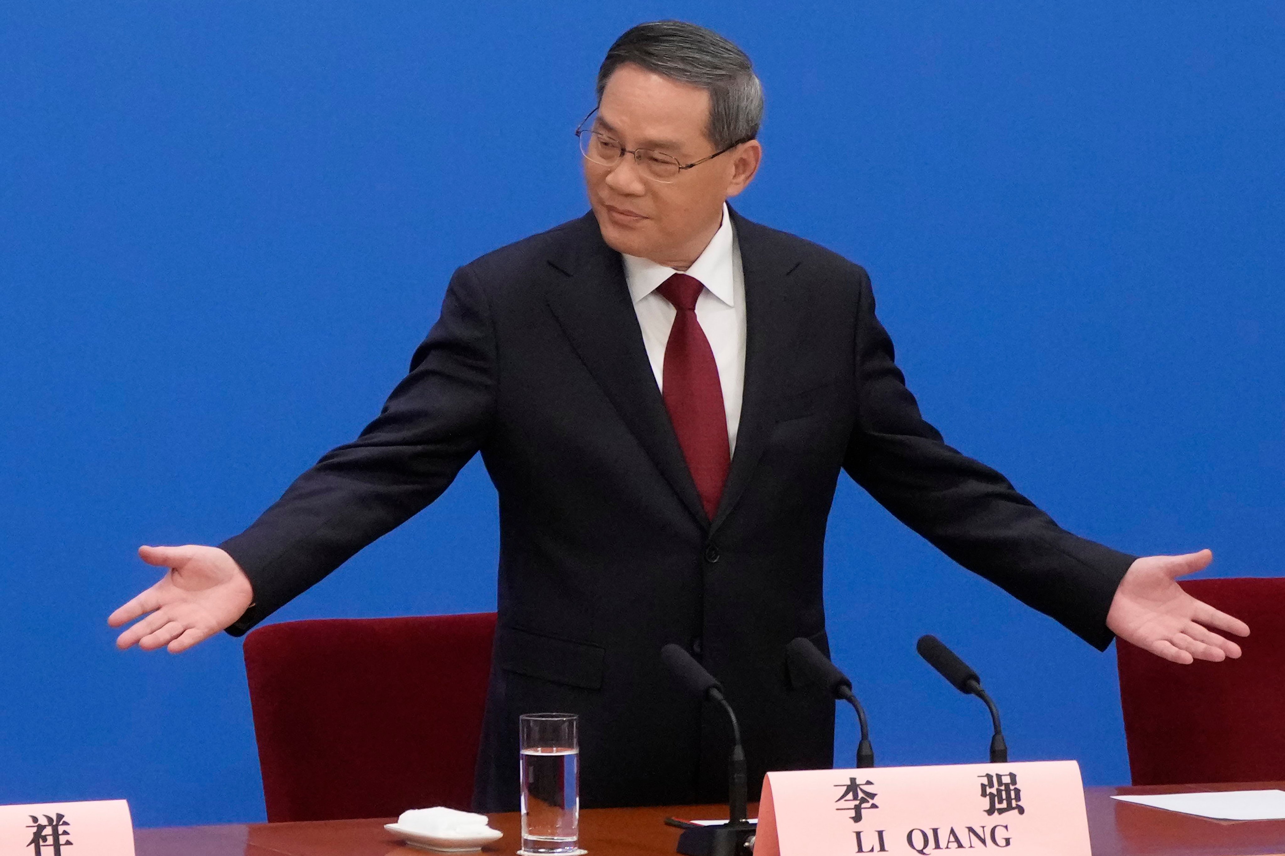 Chinese Premier Li Qiang, gestures as he arrives for a press conference after the closing ceremony for China’s National People’s Congress (NPC) at the Great Hall of the People in Beijing on March 13. Photo: AP