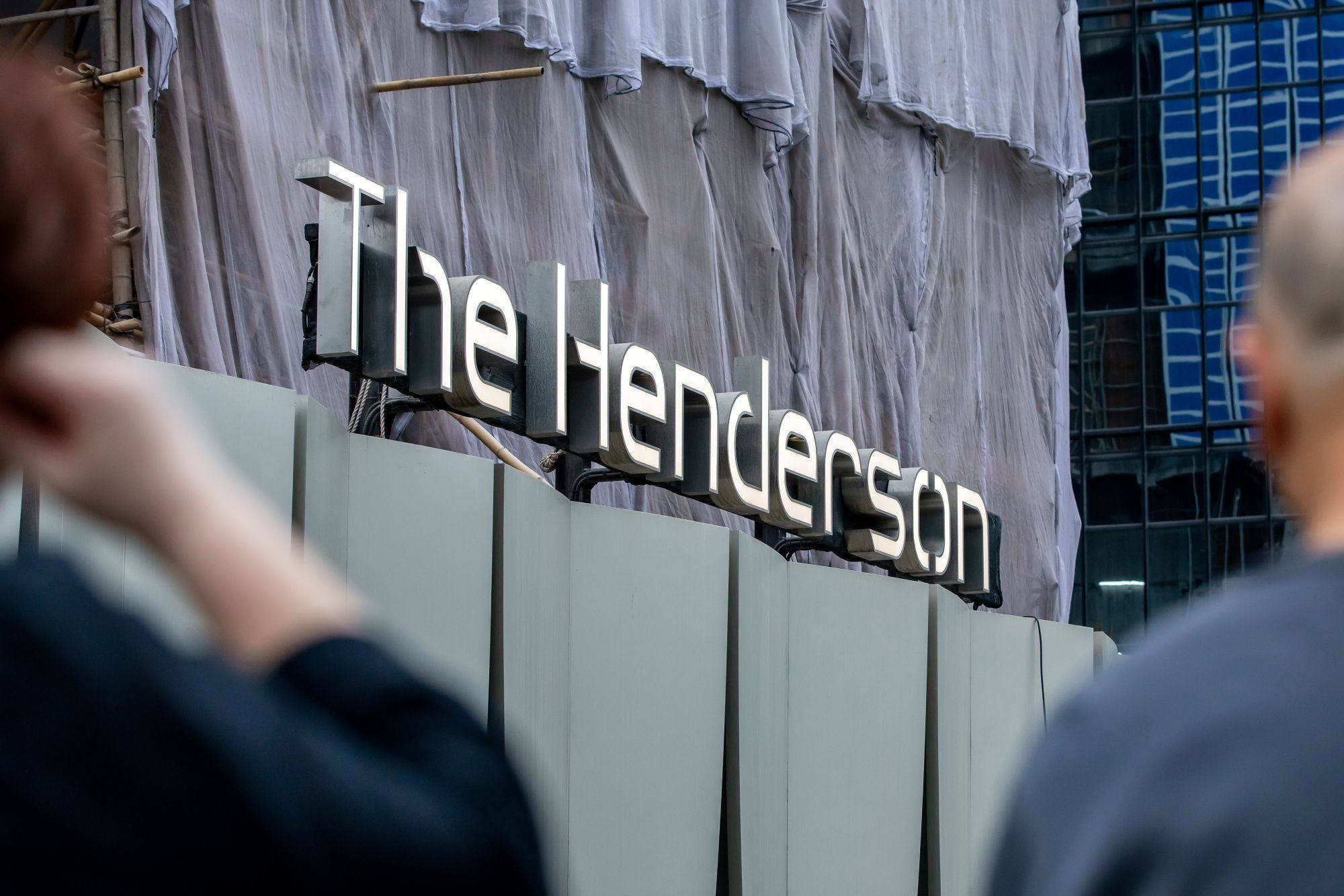 Signage at the construction site of The Henderson commercial building, developed by Henderson Land Development, in Hong Kong. Photo: Bloomberg