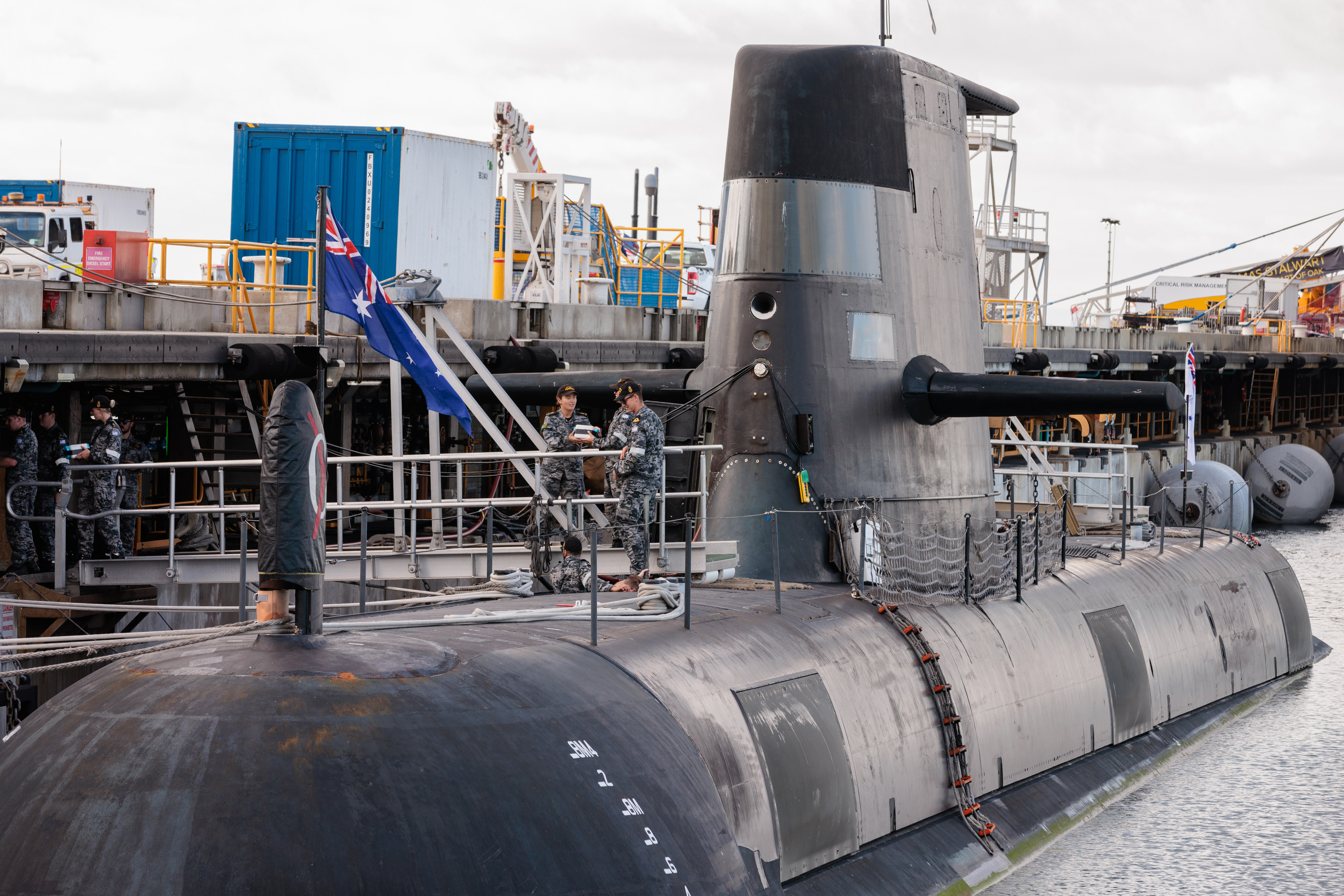 Crew members are seen working onboard HMAS Rankin, a Collins Class submarine at HMAS Stirling in Perth, during a visit by Australian Defence Minister. Photo: /dpa