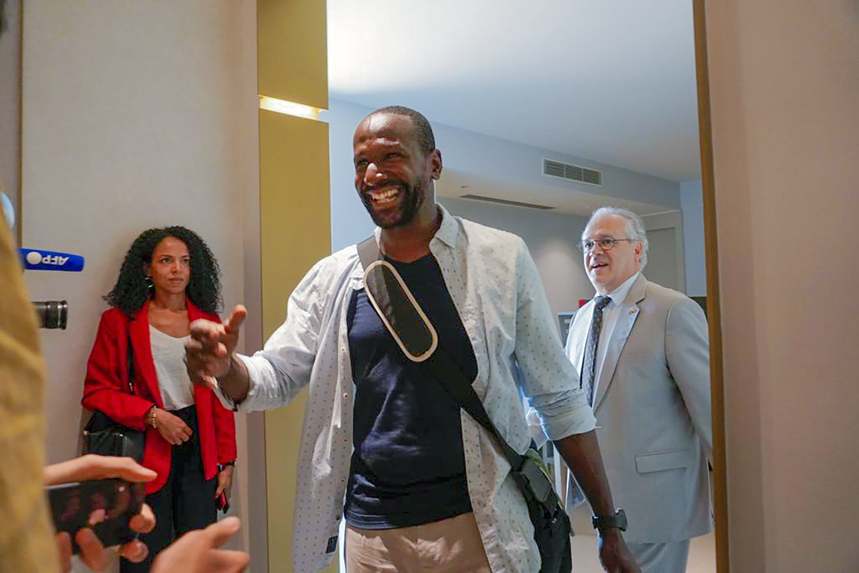 French journalist Olivier Dubois arrives at the VIP lounge at the airport in Niamey, Niger on Monday, nearly two years after he was abducted and held by Islamic extremists. Photo: AP