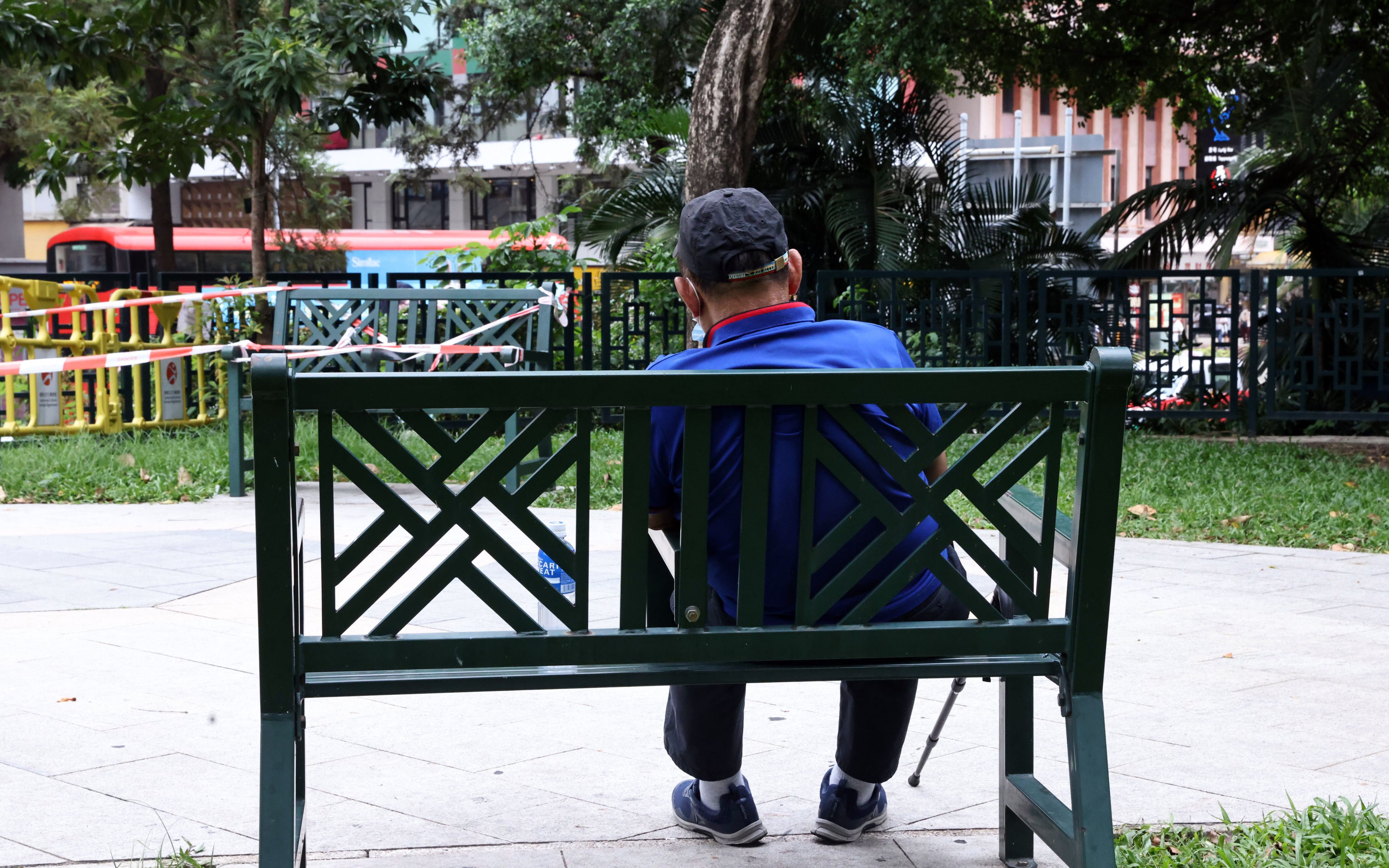 An elderly person sits in a public garden in Hong Kong’s Jordan district on October 10, 2022. Photo: K.Y. Cheng