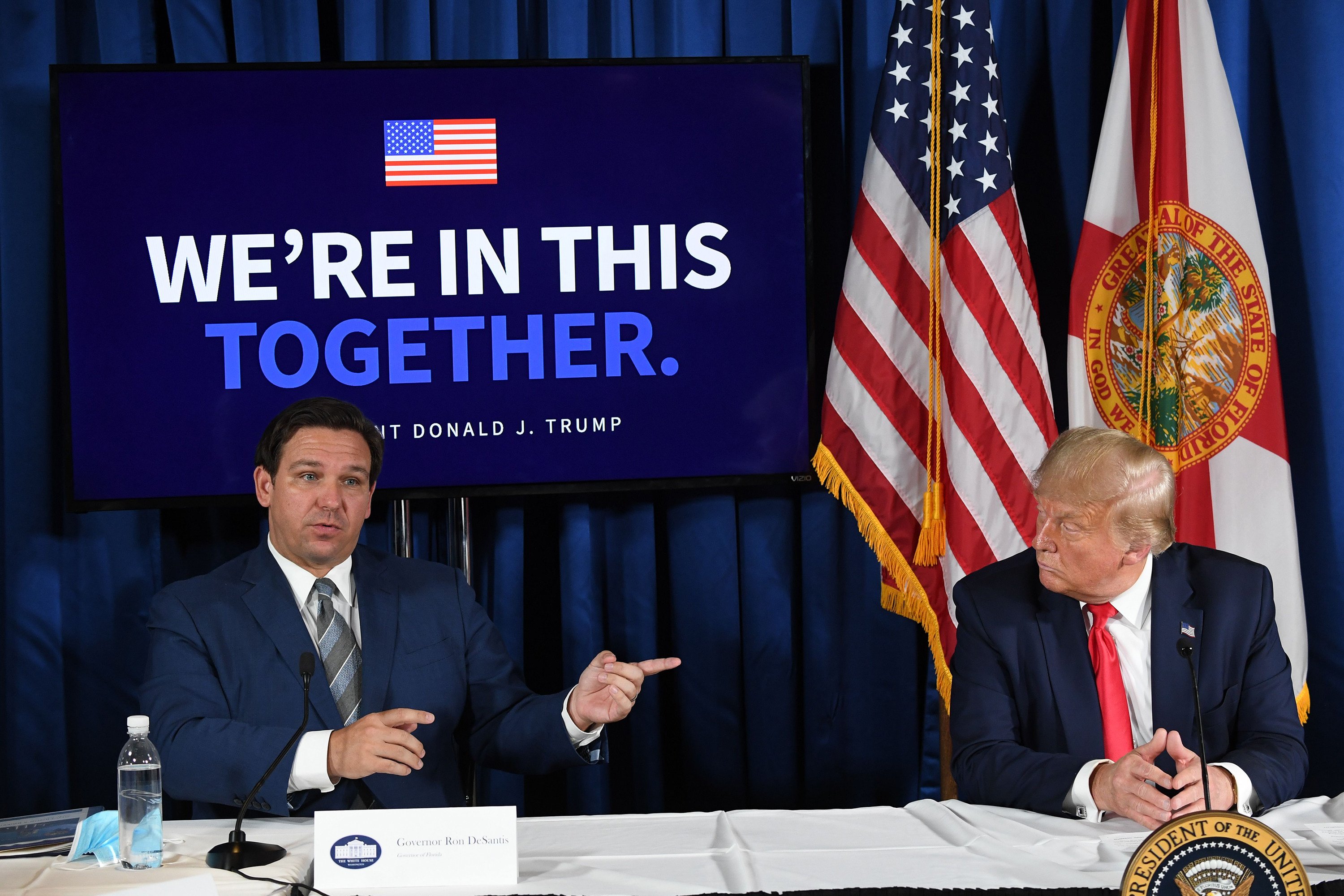 Florida governor Ron DeSantis and then-president Donald Trump at a Covid-19 and storm preparedness roundtable in Belleair, Florida, on July 31, 2020. Photo: AFP / Getty Images / TNS