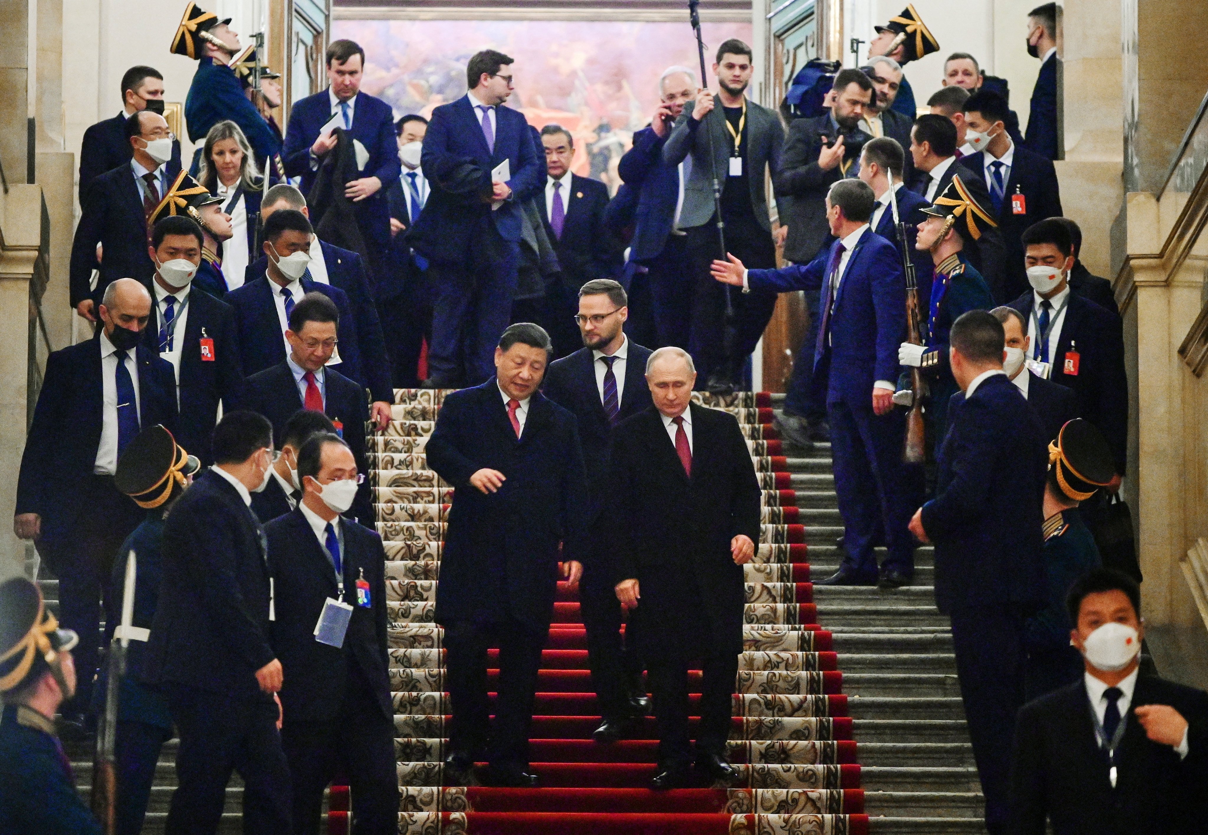 Russian President Vladimir Putin and Chinese President Xi Jinping leave after a reception at the Kremlin in Moscow on March 21. Photo:  Sputnik/Kremlin via Reuters