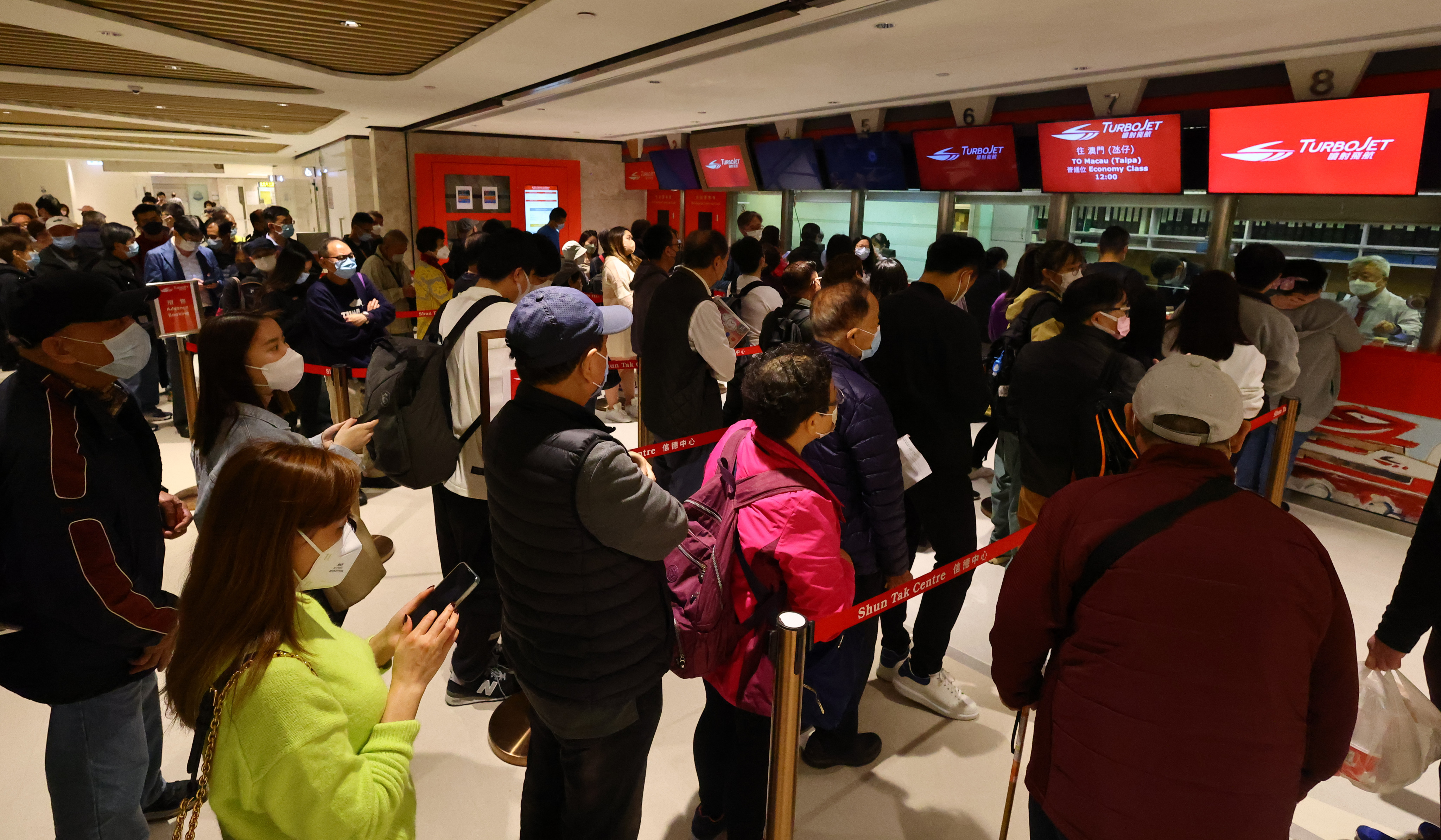 Travellers queue up for tickets at the Macau Ferry Terminal at Shun Tak Centre, on January 13, 2023. Shun Tak Holdings expects tourism activity to pick up this year. Photo: Dickson Lee
