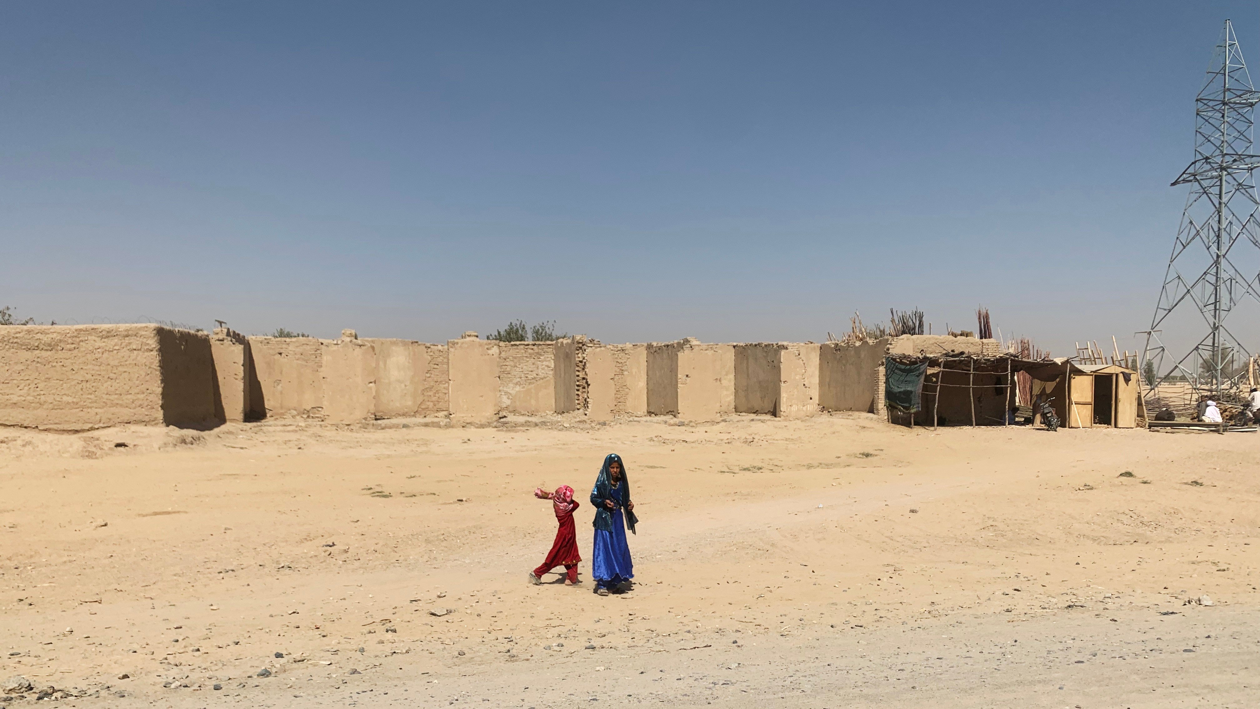 Two girls outside a compound in Kandahar province, Afghanistan. The Taliban are in dire need of foreign aid to fix their war-torn country, but their anti-female laws make them a pariah to the detriment of millions of Afghans. Photo: Lindsey Kennedy