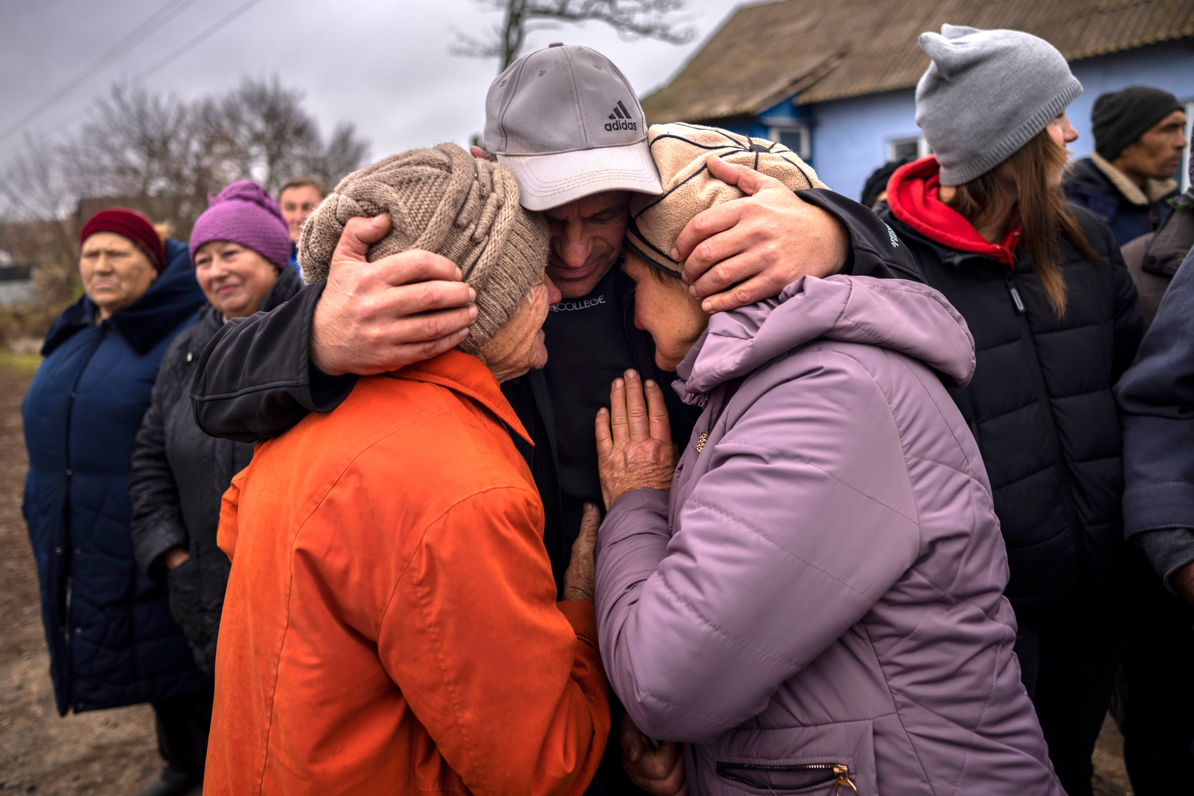 In the village of Tsentralne, Ukrainian family members meet for the first time since Russian troops withdrew from the Kherson region, southern Ukraine, on November 13 last year. Despite the war, the World Happiness Report survey found “remarkably resilient” happiness levels in Ukraine, supported by a stronger sense of common purpose, benevolence and people’s trust in their leadership. Photo: AP