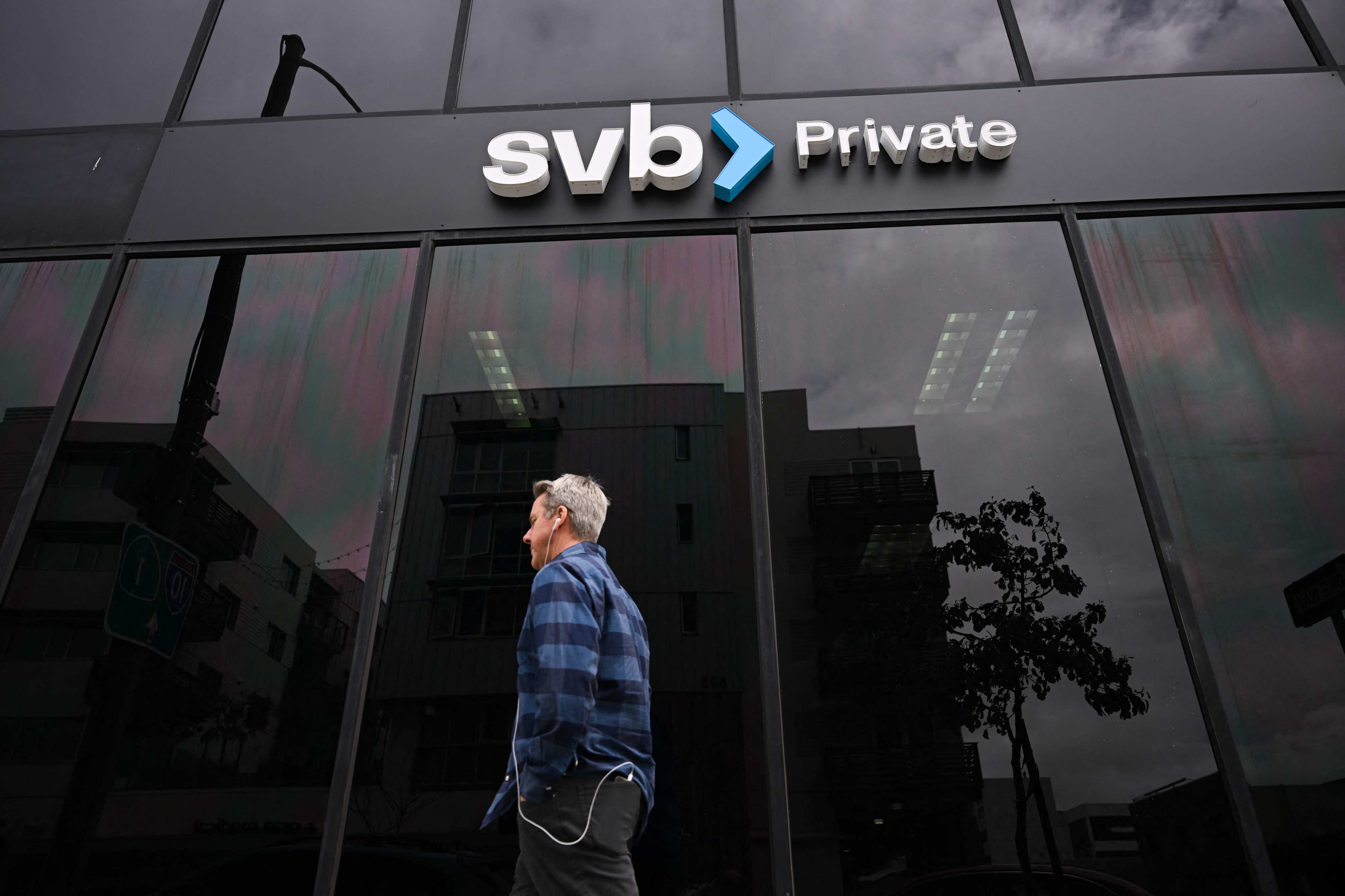 A man walks past a Silicon Valley Bank branch in Santa Monica, California on March 20. SVB, a key lender to start-ups across the US since the 1980s and the country’s 16th-largest bank by assets, had been hit by the tech sector slowdown. Photo: AFP