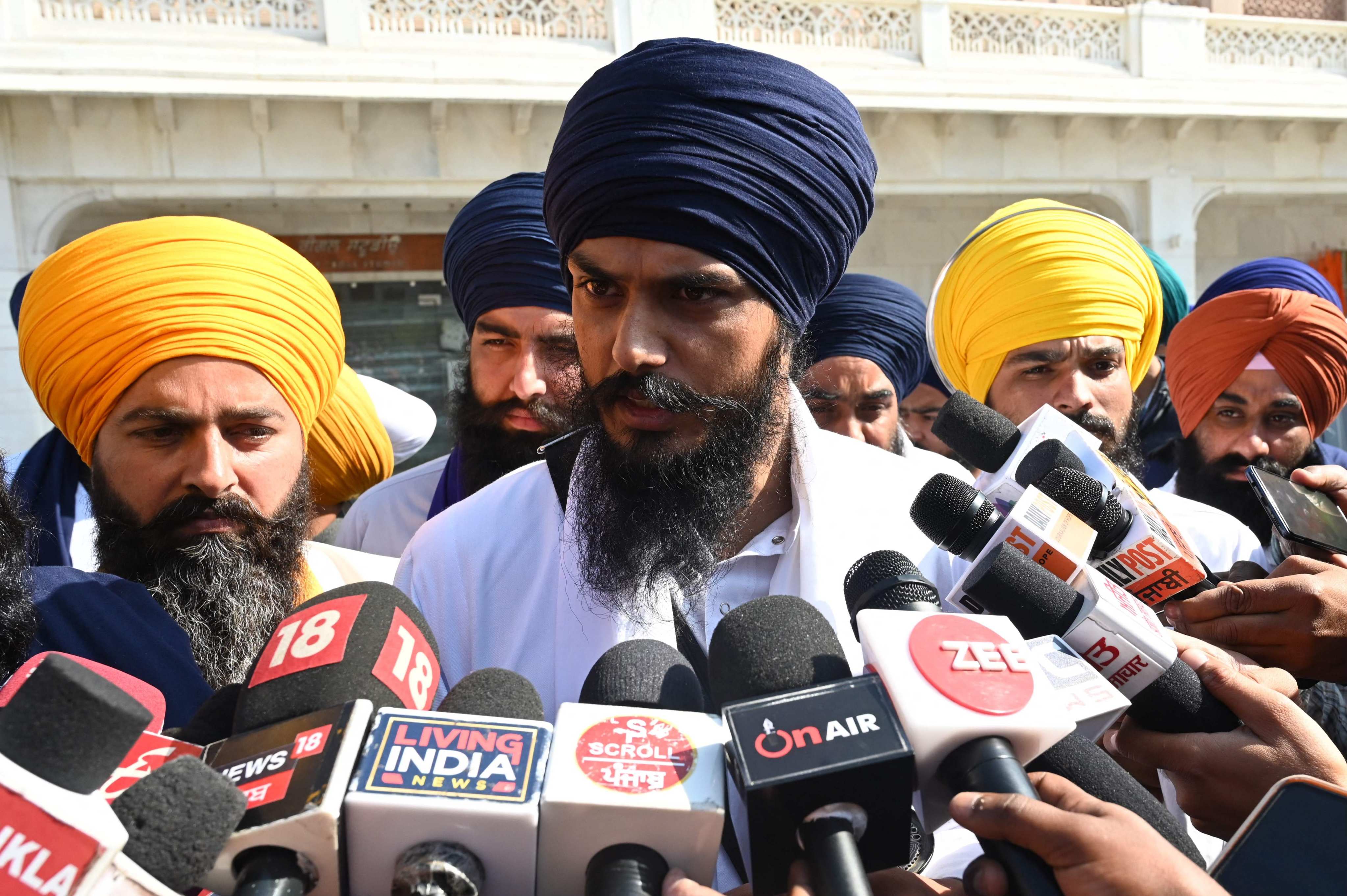 ‘Waris Punjab De’ chief Amritpal Singh, centre, speaks to the media, at the Golden Temple in Amritsar, India. Photo: AFP