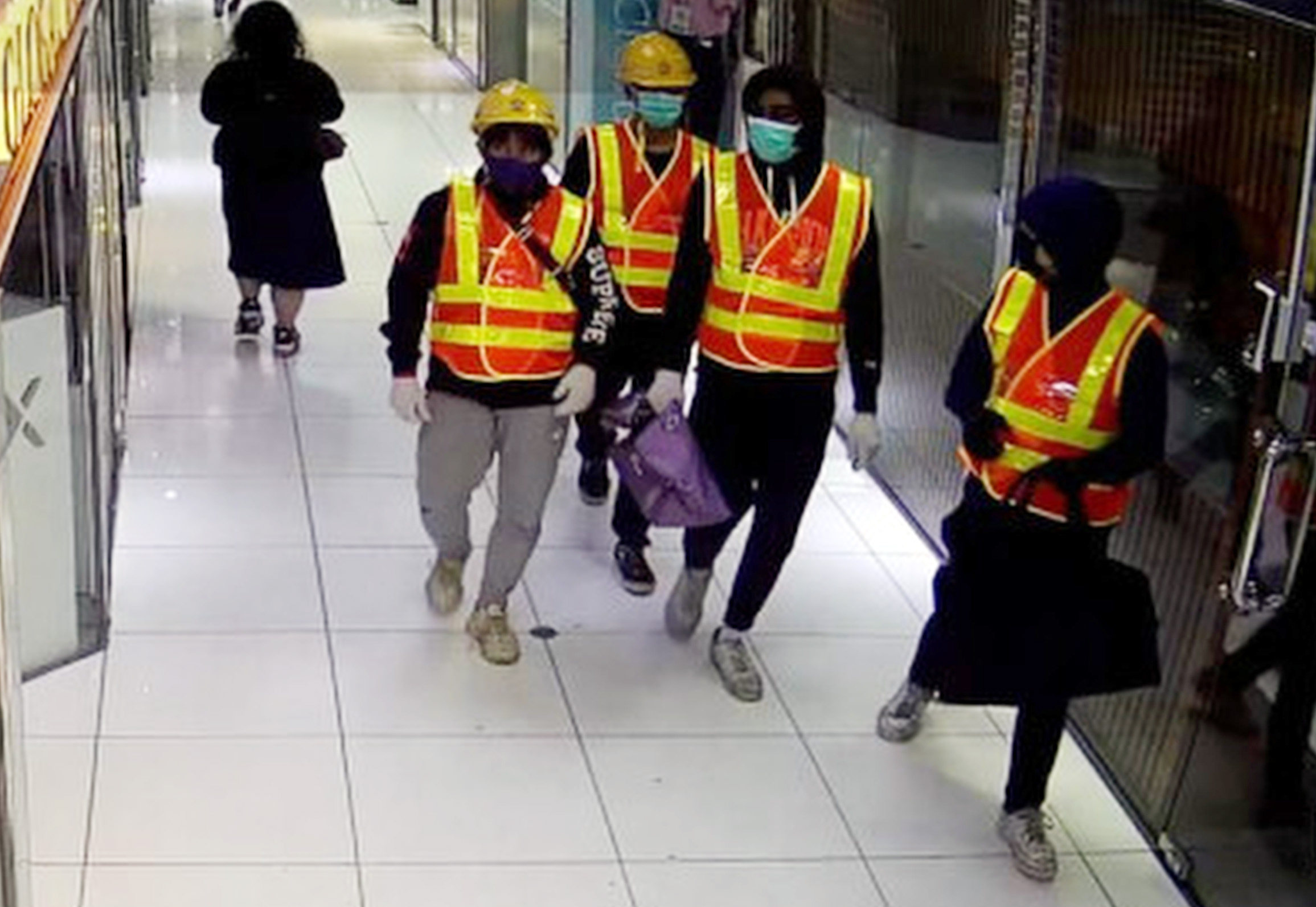 The four men dressed as construction workers who stole HK$10 million worth of luxury watches in a raid on a store in Tsim Sha Tsui. Photo: Handout