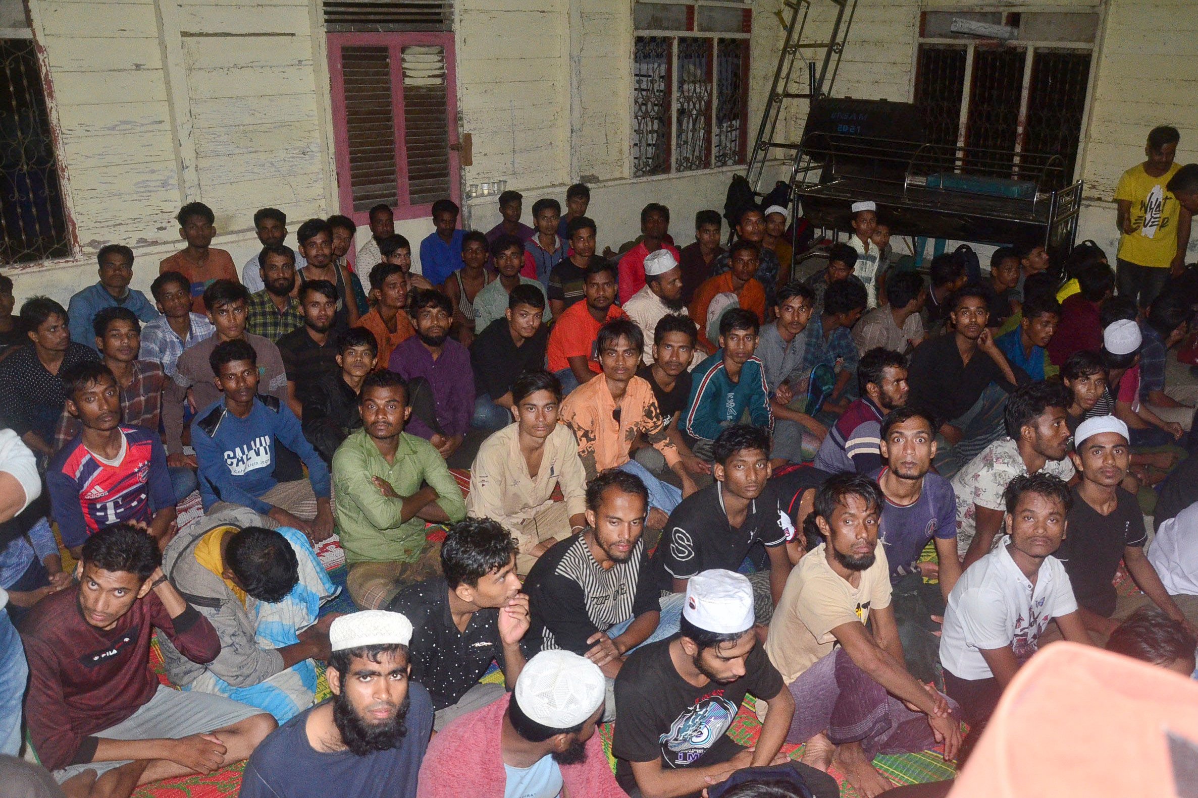 Ethic Rohingya men rest inside a mosque that is turned into a temporary shelter after they land in Kuala Matang Peulawi, Aceh province, Indonesia on March 27, 2023. Photo: AP