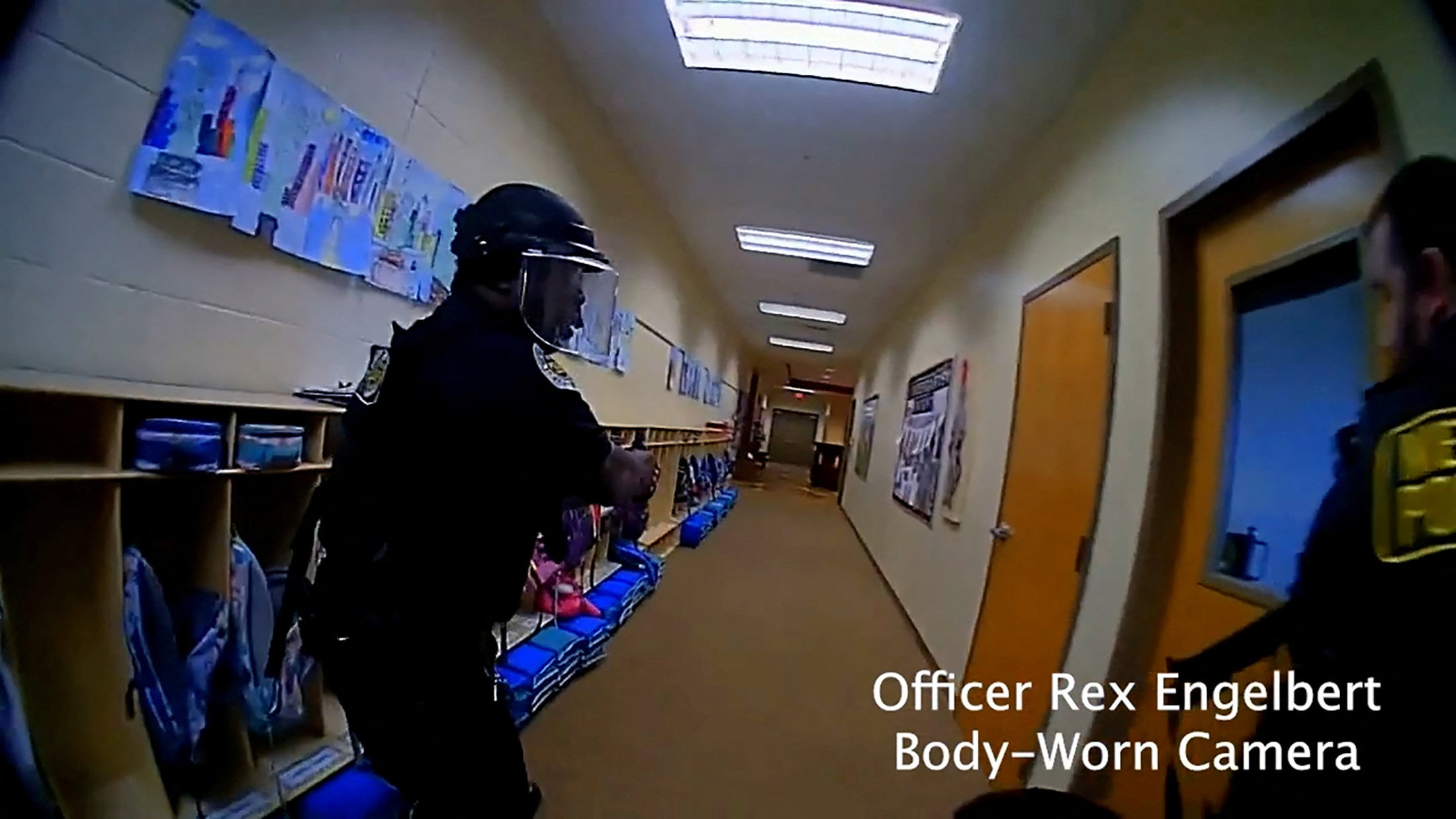 Police officers search for the mass shooting suspect in The Covenant School, in a still image from body camera video in Nashville, Tennessee, on Monday. Photo: Metropolitan Nashville Police Department via Reuters