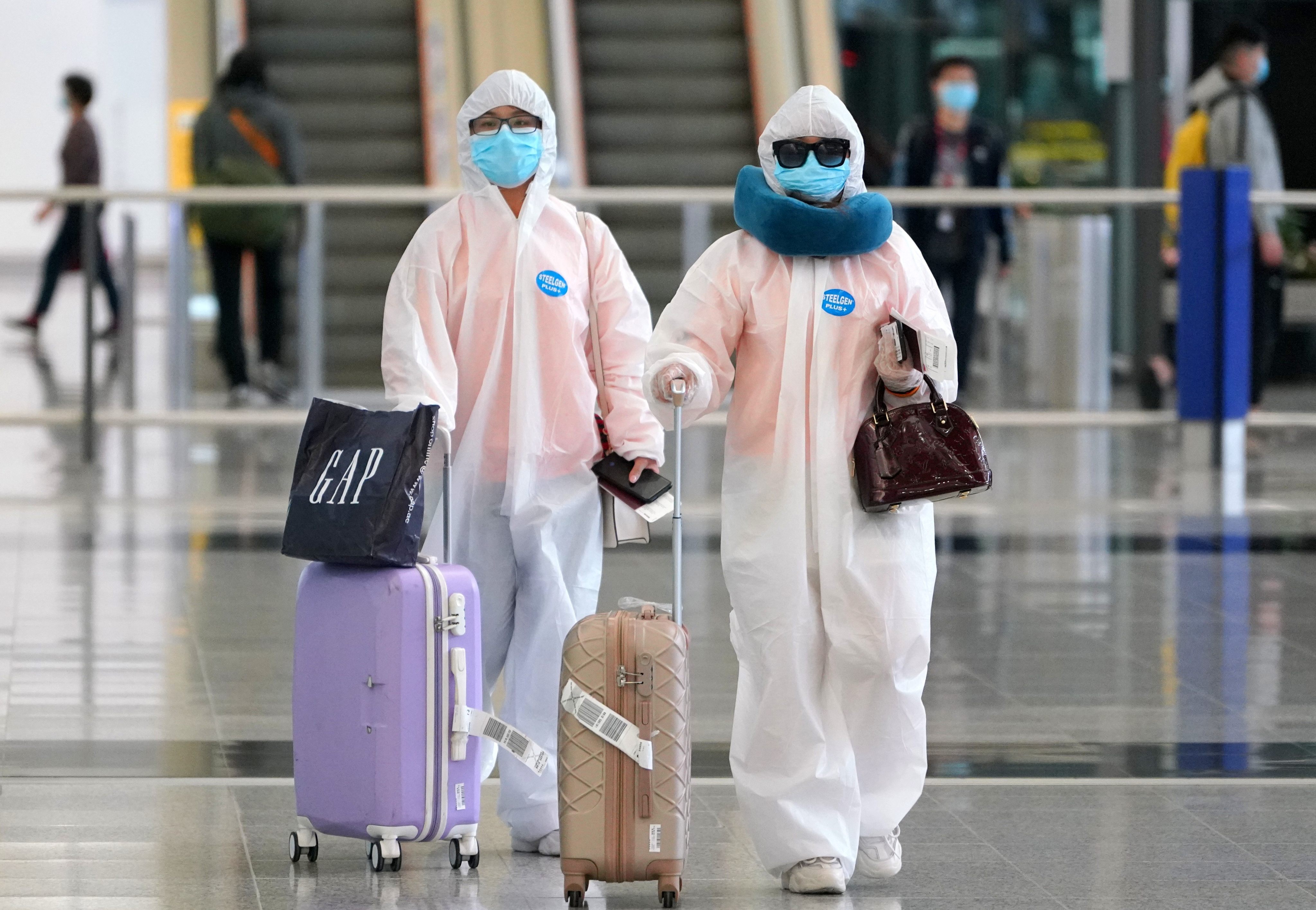 Passengers arriving at Hong Kong International Airport during the Covid-19 pandemic. Travel restrictions, testing and quarantine requirements stopped many people visiting Hong Kong for nearly three years, and affected tourism and the restaurant trade. Photo: Getty Images