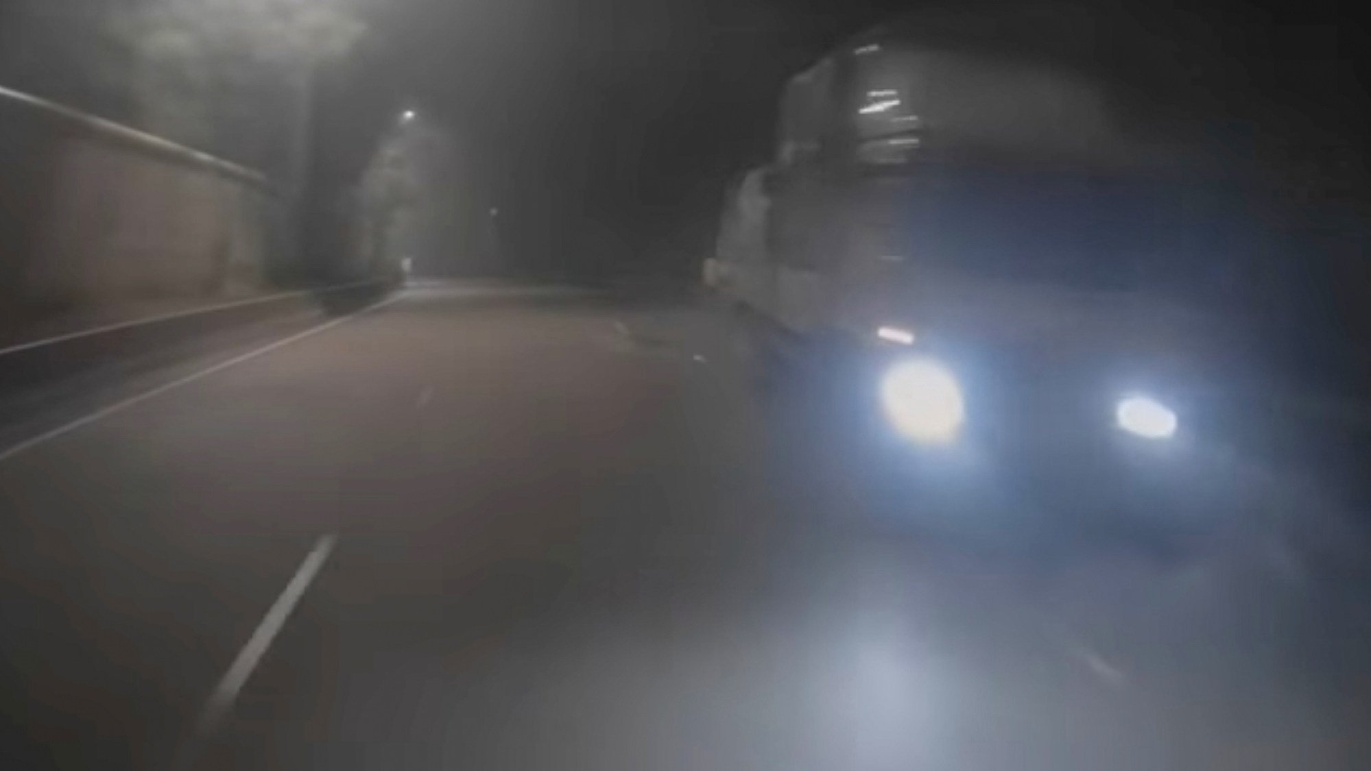 A still from footage taken from a dashboard camera shows the two trucks moments before the collision with the taxi. Photo: Handout