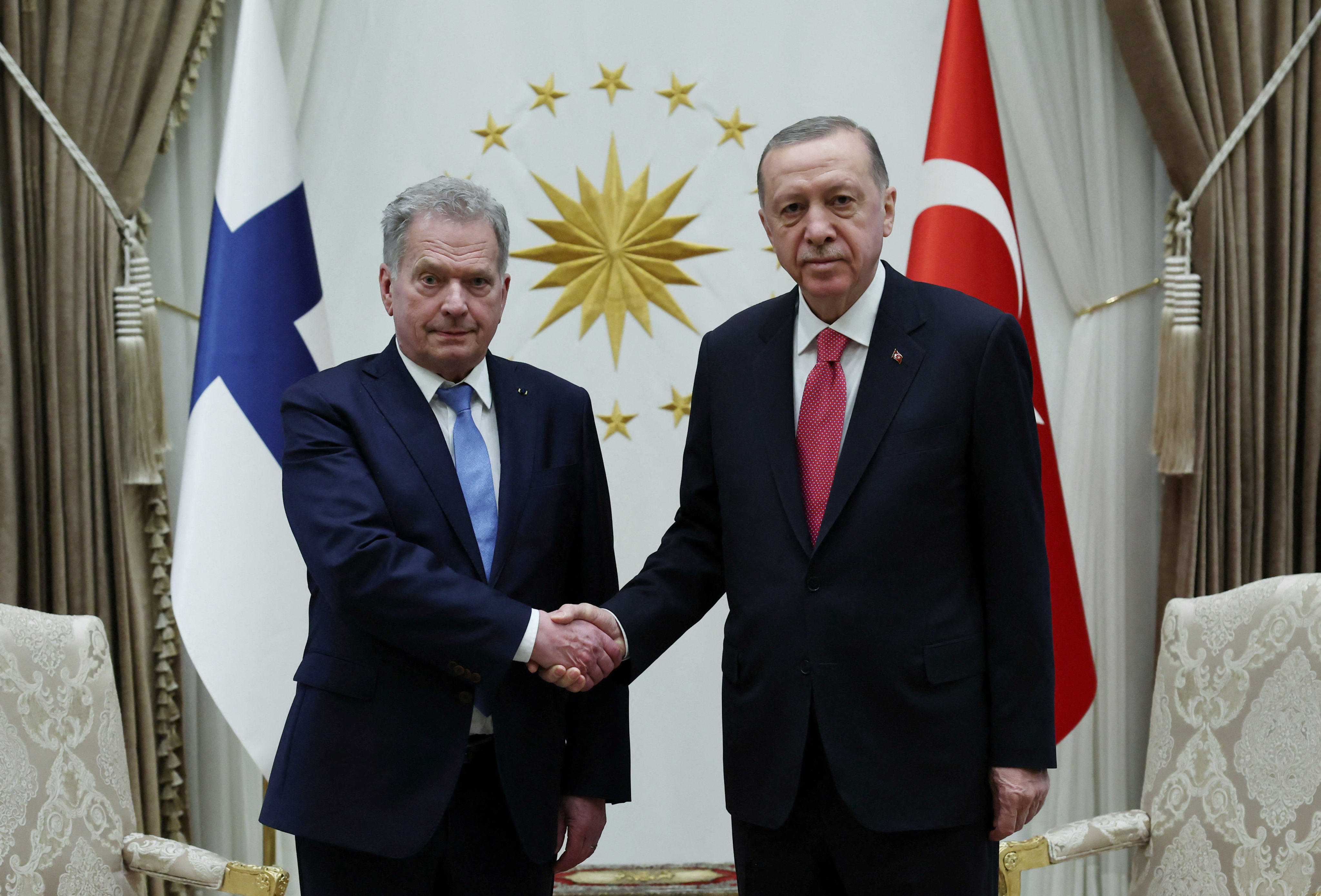 Turkey’s President Recep Tayyip Erdogan (right) and Finland’s President Sauli Niinisto shake hands during their meeting in Ankara on March 17. Photo: Turkish Presidential Press Office via Reuters