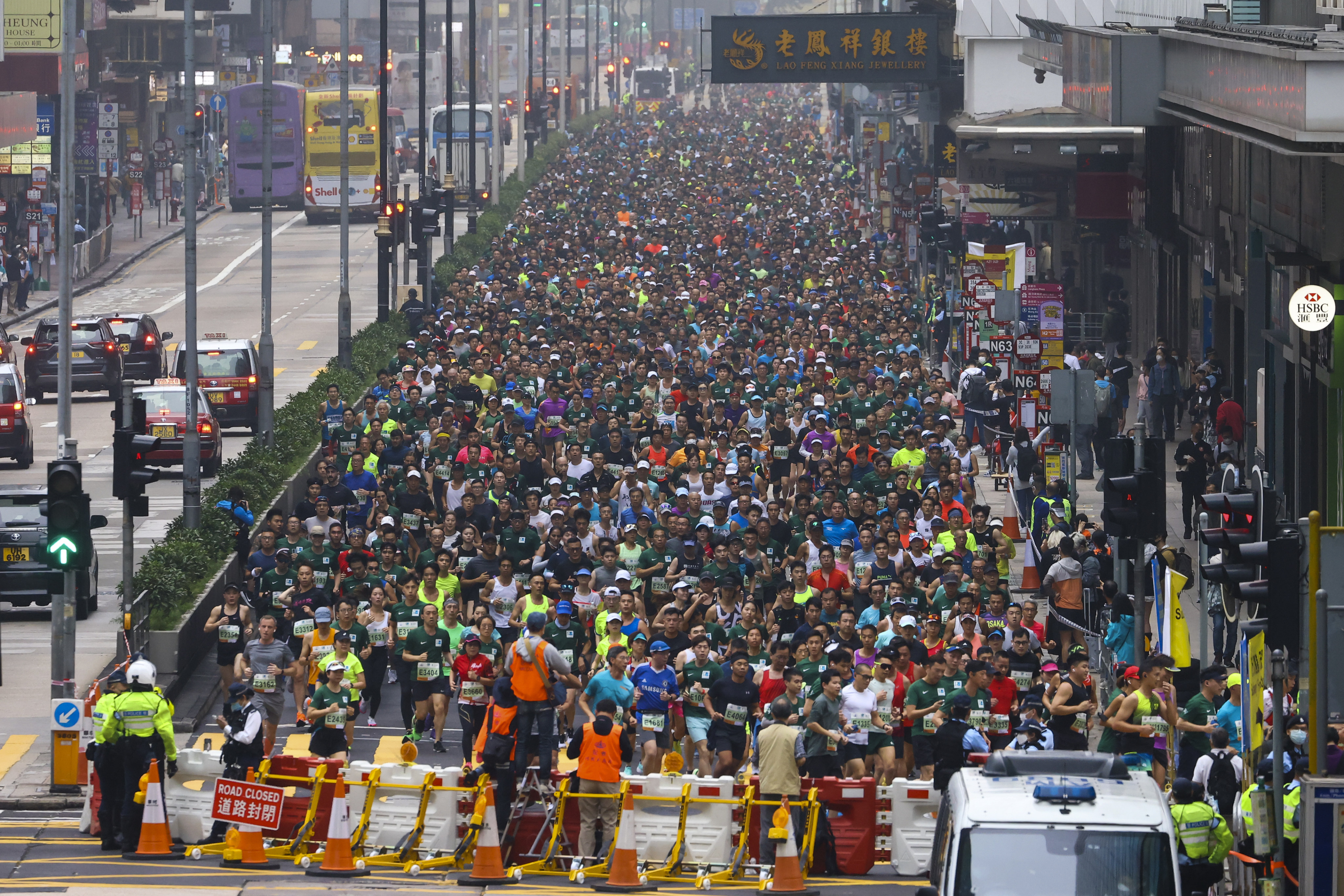 Competitors run through Mong Kok during the  Standard Chartered Hong Kong Marathon in February.  Photo: Dickson Lee