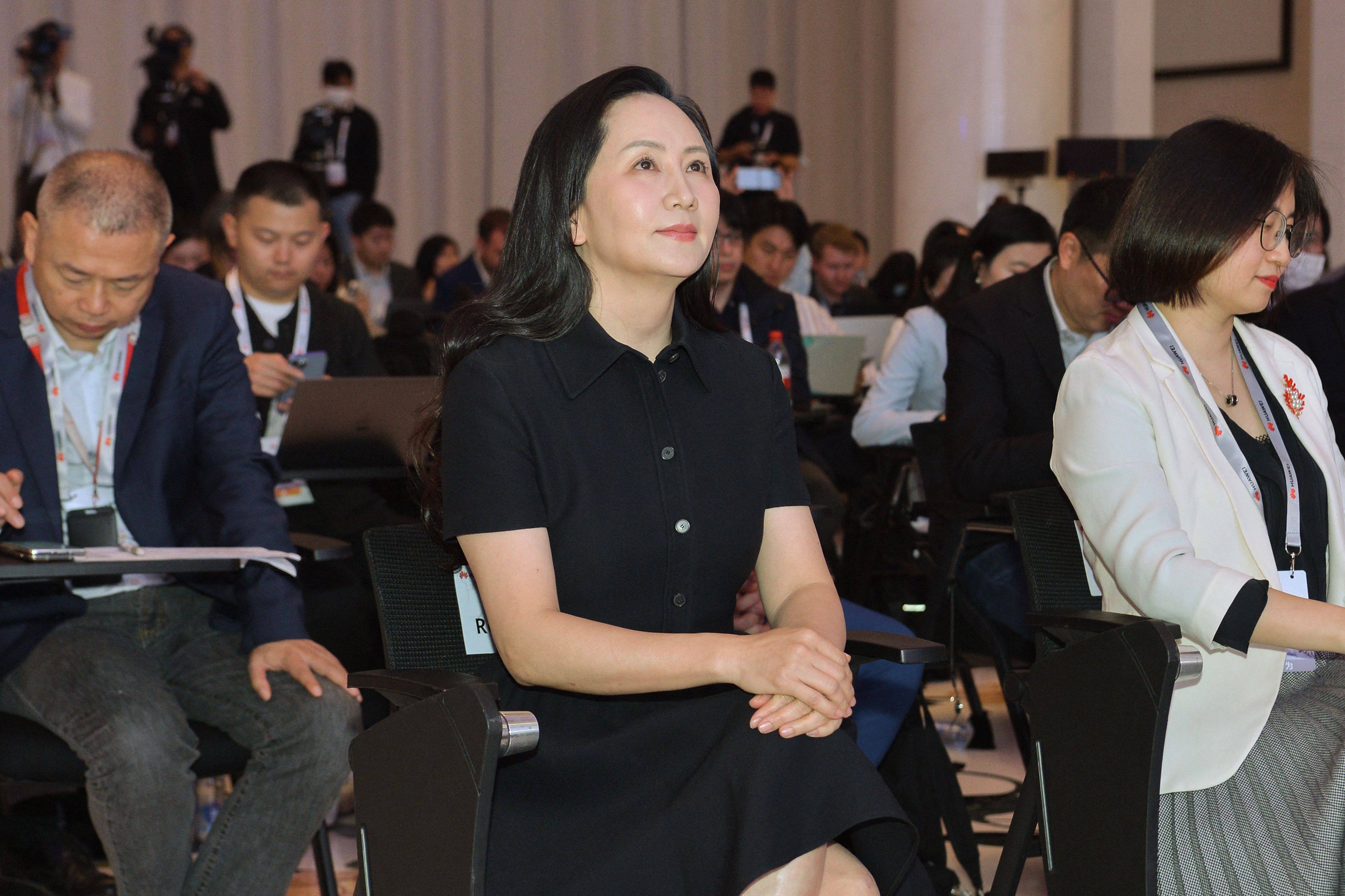 Huawei Technologies Co chief financial officer Meng Wanzhou, centre, looks on after arriving for the firm's 2022 annual report press conference in Shenzhen on March 31, 2023. Photo: AFP