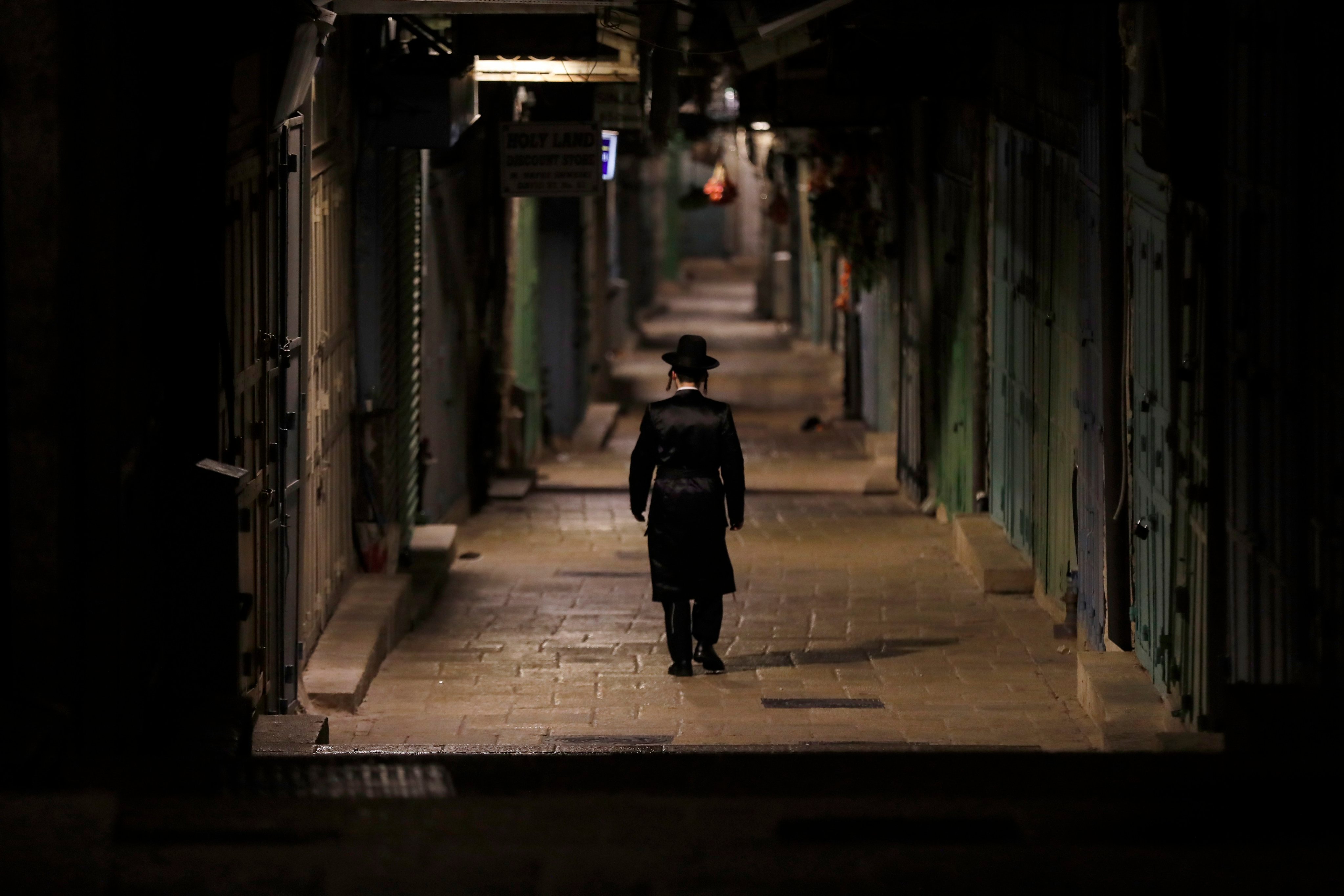An Ultra-Orthodox Jewish man walking in the alley of the Chain gate leading to the Al-Aqsa mosque compound in Jerusalem. Photo: EPA-EFE